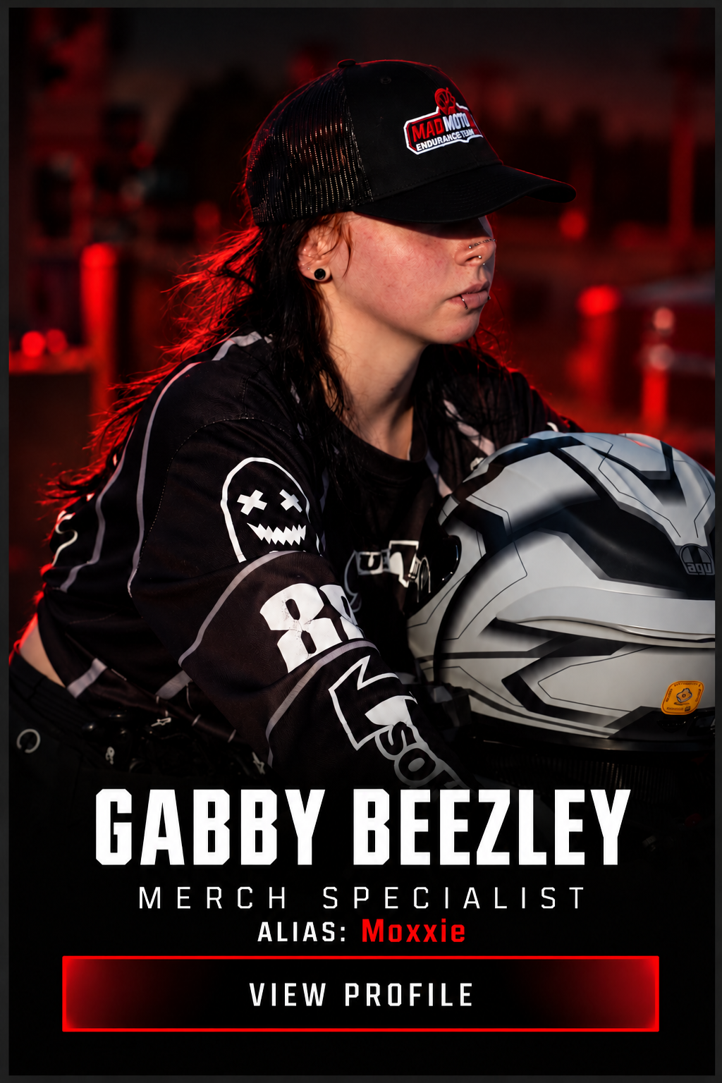 Gabby Beezley, alias Moxxie, in motocross gear and helmet, featured as a merch specialist profile.