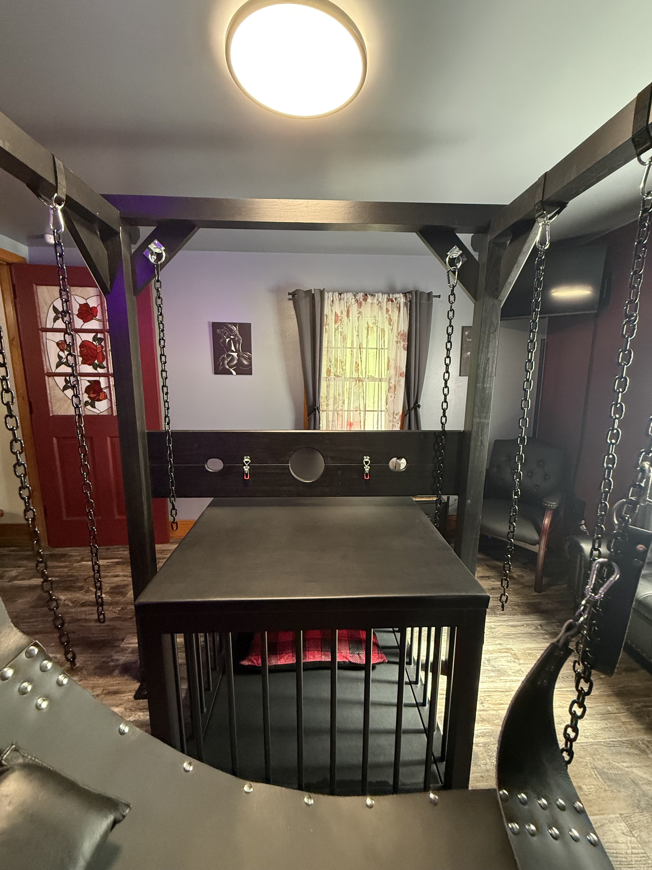 pillory with a swing and cage