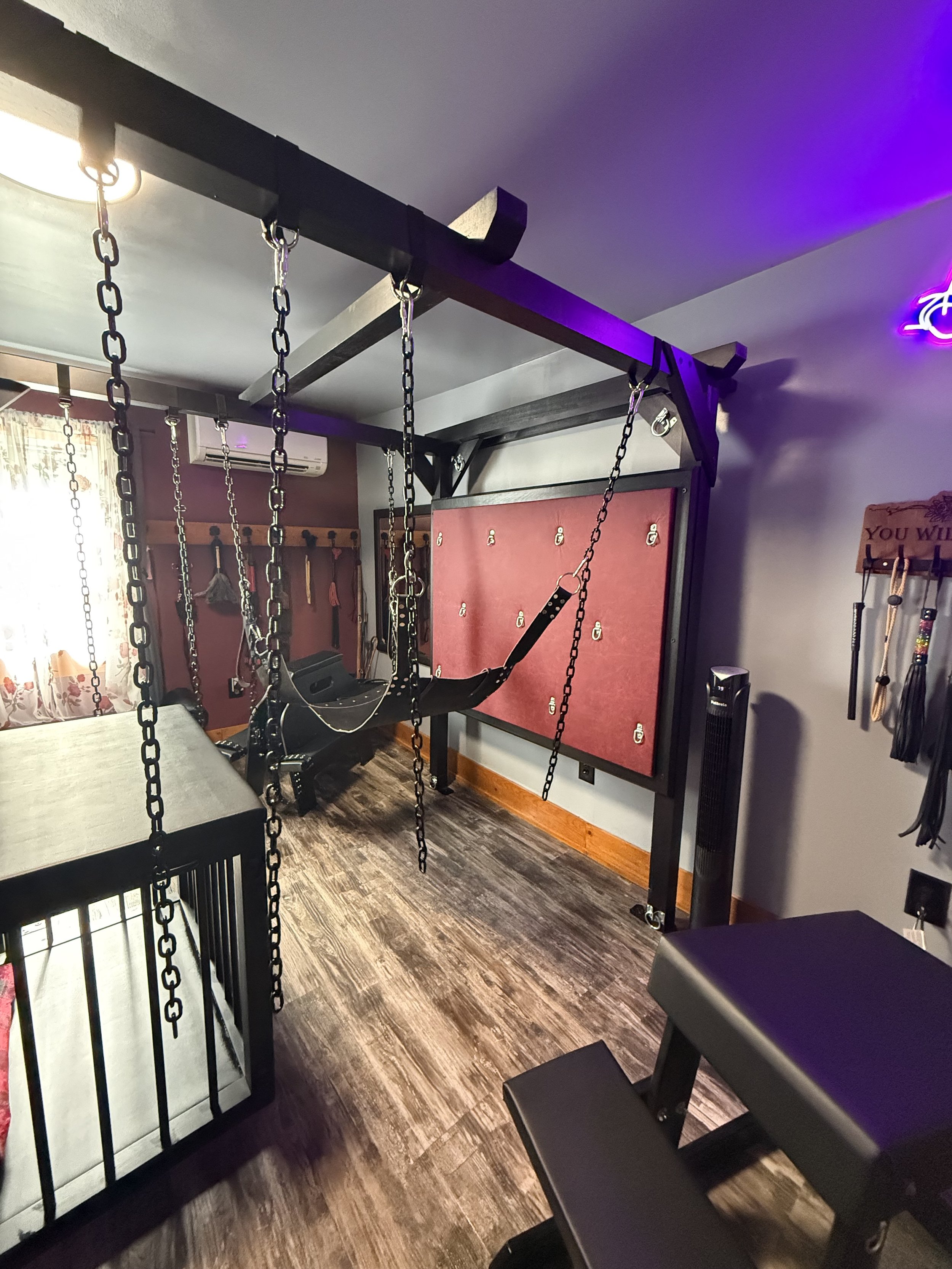 The cage slides forward to allow for the use of the swing