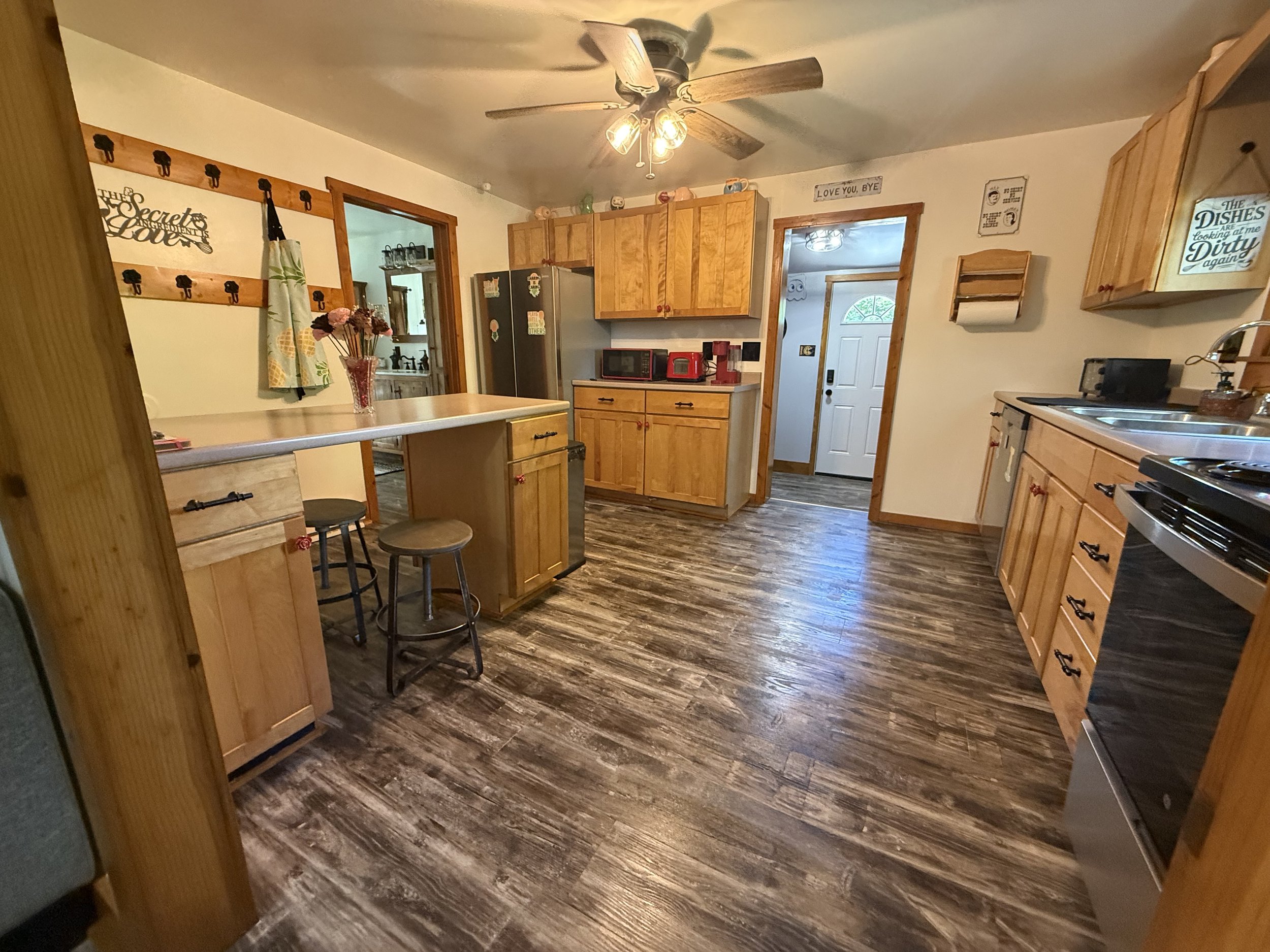 A kitchen comes fully stocked with pans and dishes for your stay 