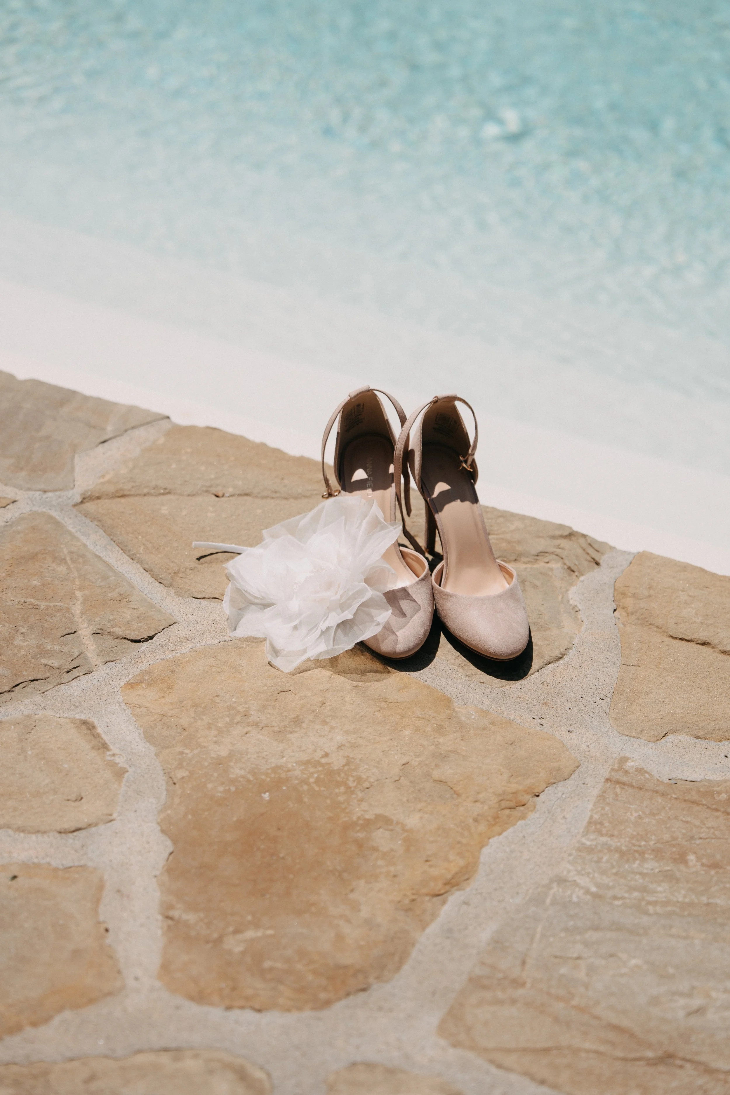 A beautiful bride with her spouse in a magical tuscan mill