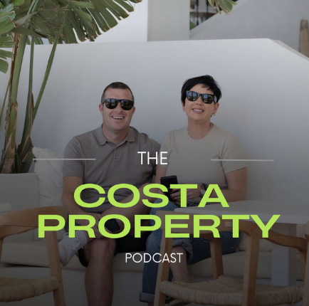 Two people wearing sunglasses sitting outdoors with a white wall and greenery behind them, smiling at the camera, with overlay text that reads 'The Costa Property Podcast.'