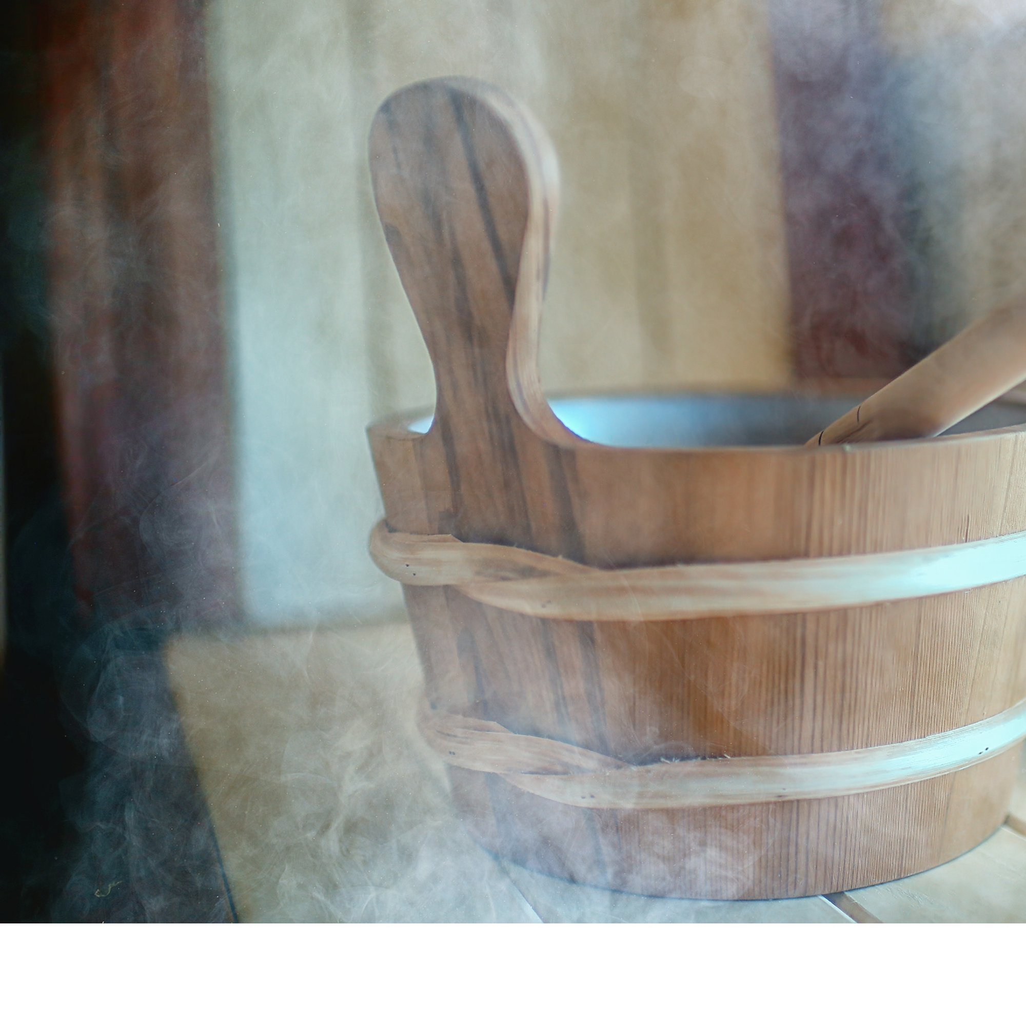 A close-up photo of a wooden bucket with a smooth finish and natural wood grain patterns, surrounded by soft steam, 