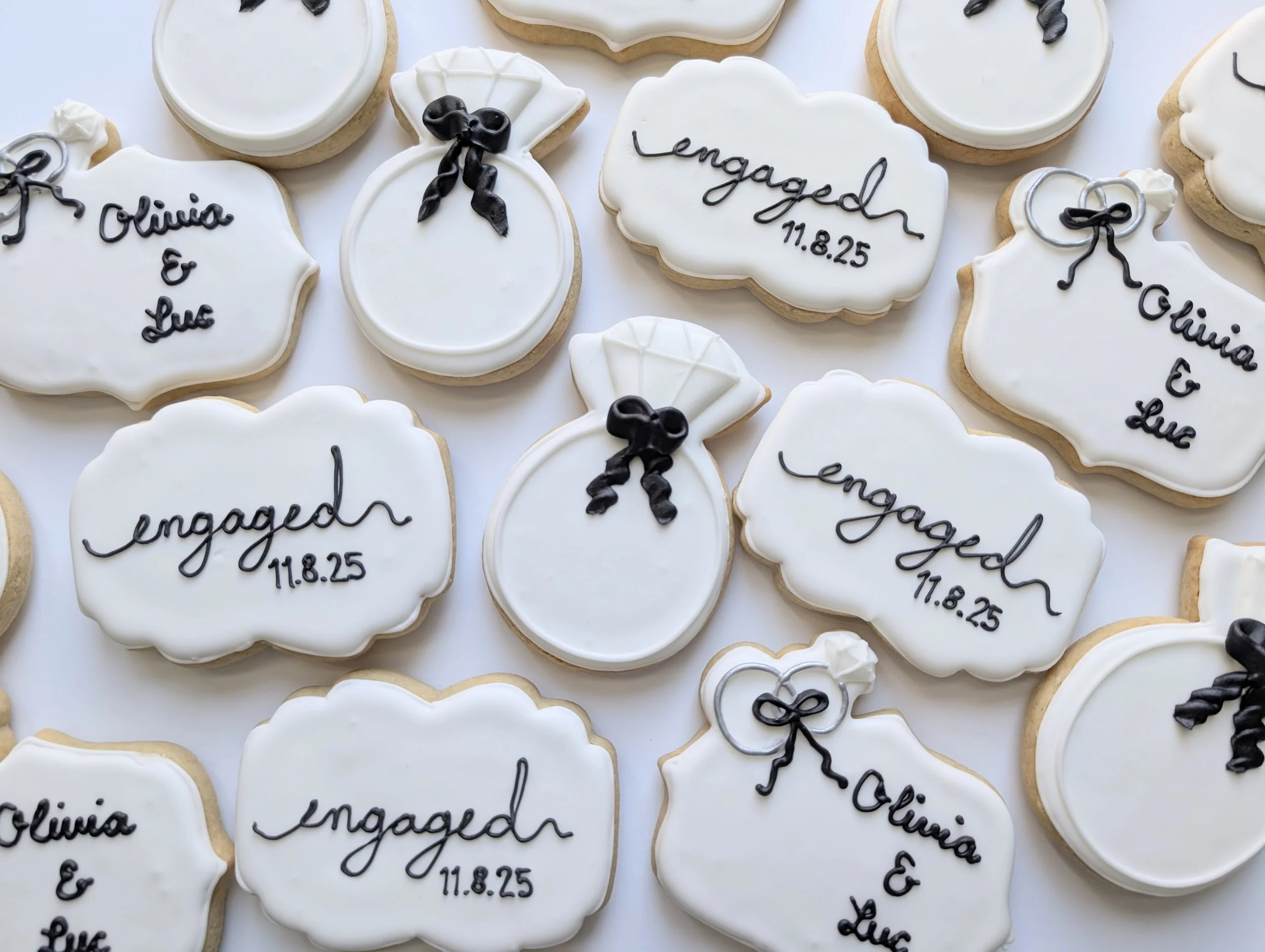 Engagement themed cookies with dates and names
