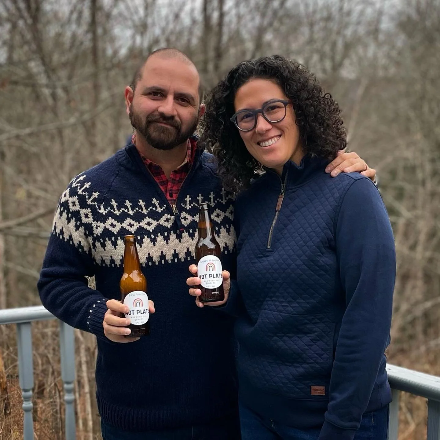 hot plate brewing owners holding beer