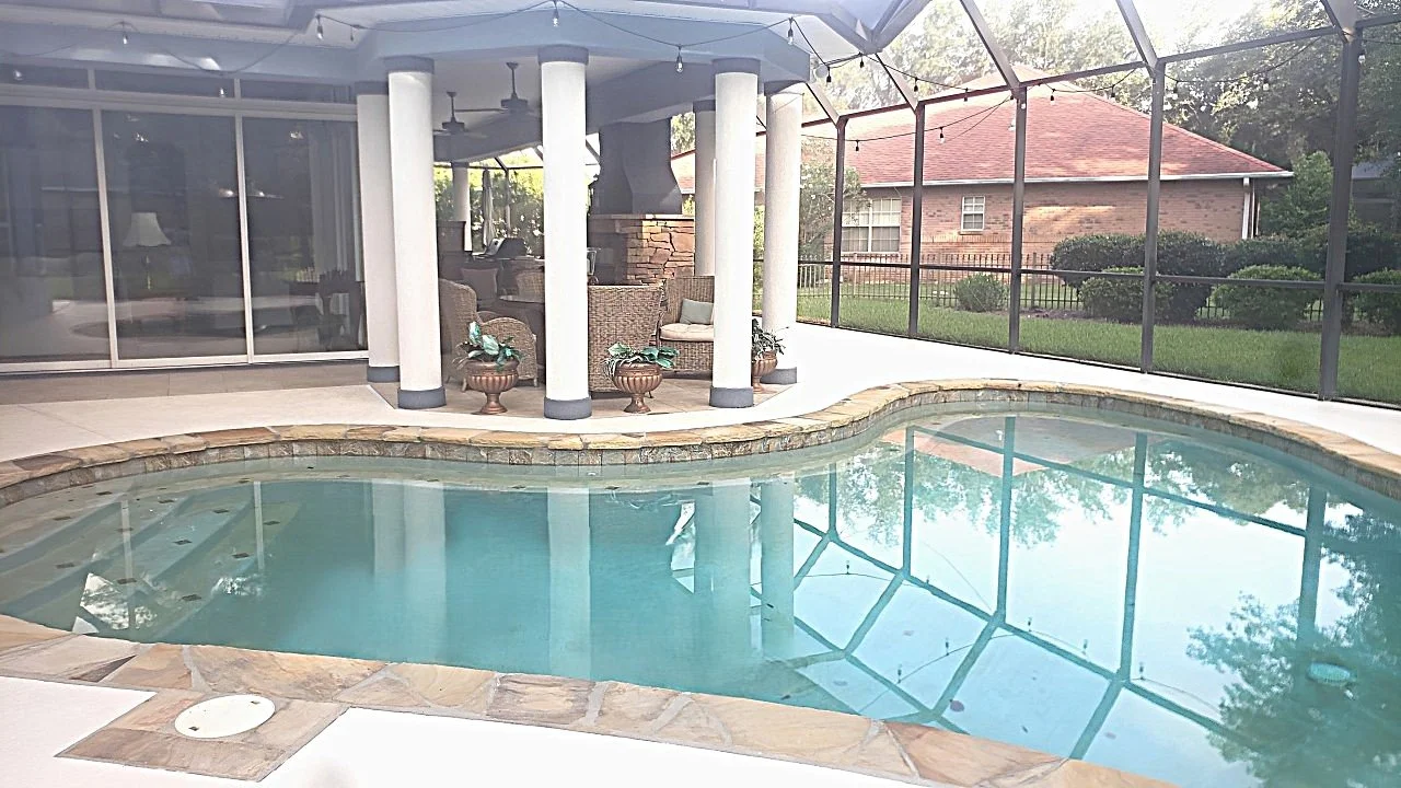 Concrete stained pool deck with columns and trimwork.