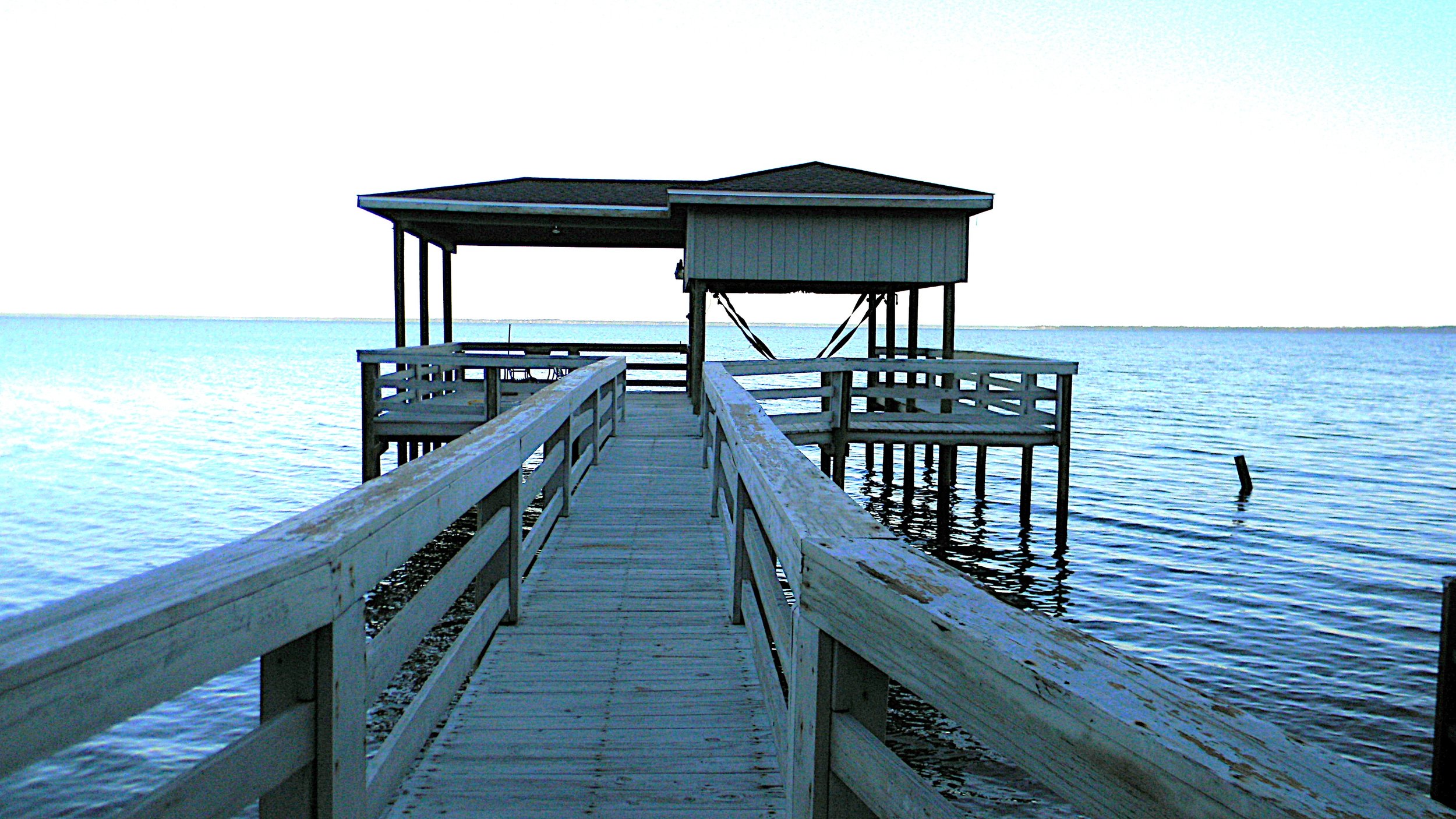 BEFORE - Repainting dock, railing, walkway, and dock house.