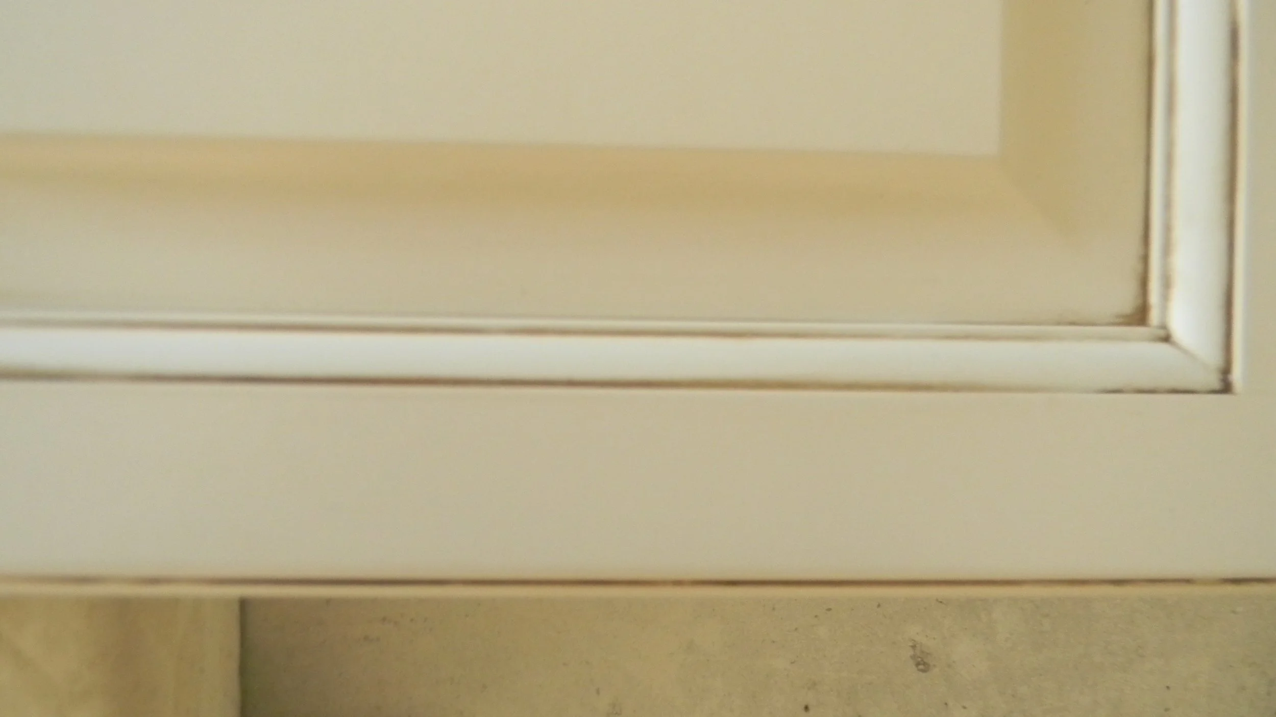Close-up of refinished cabinets with Faux Finished "Antiquing" technique.