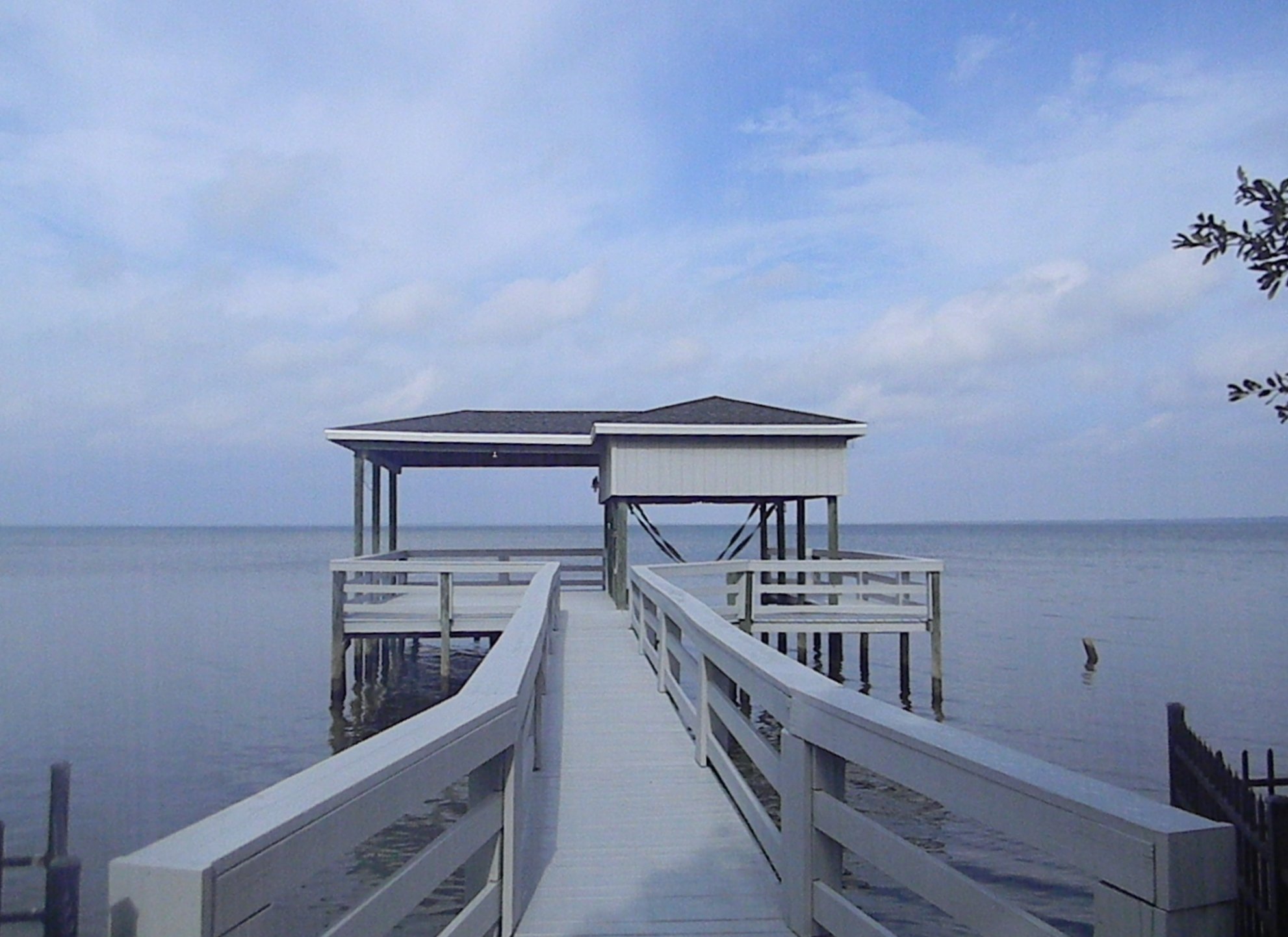 AFTER - Repainted dock, railing, walkway, and dock house.