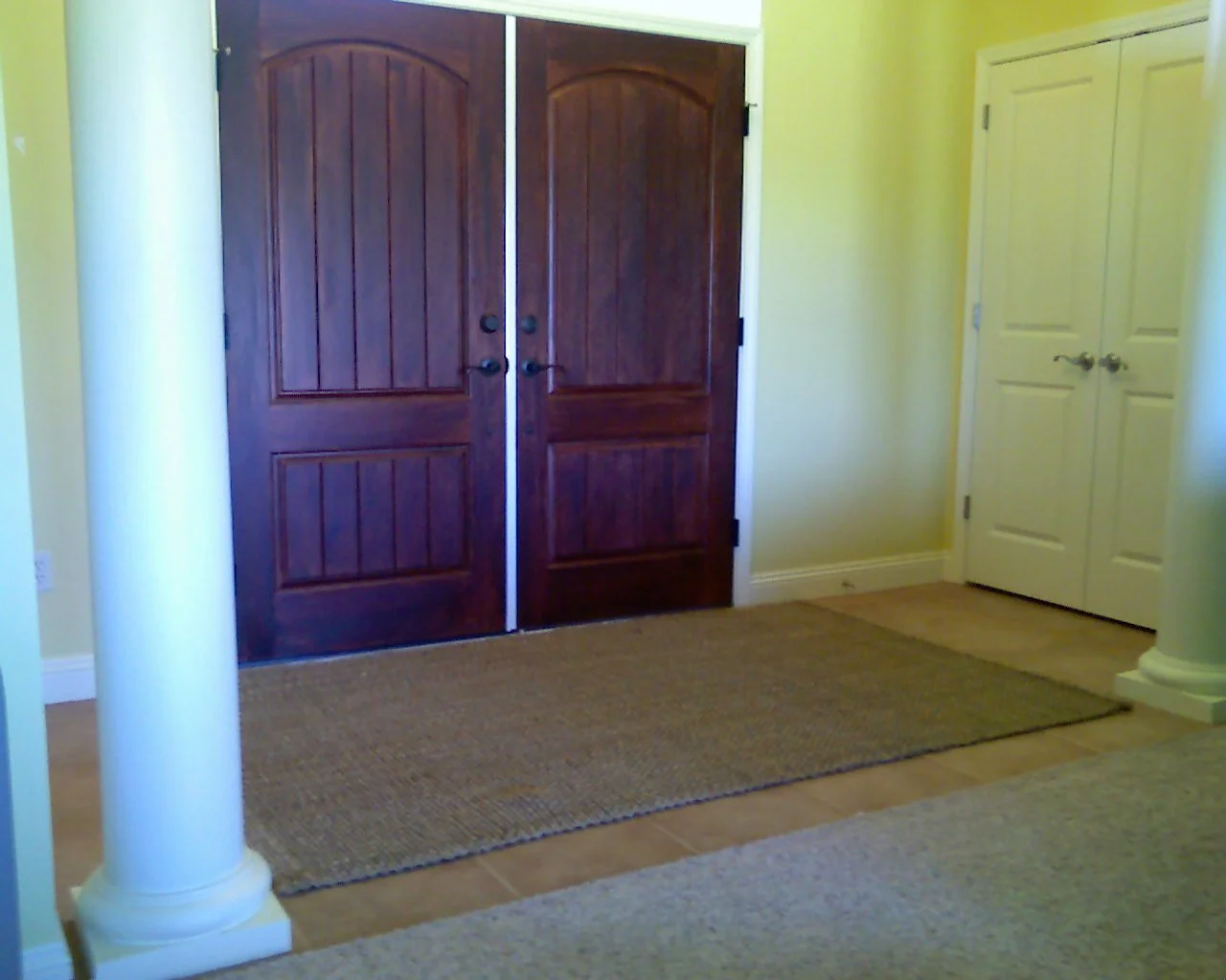 Faux Finished double door staining, wall, door, column, and baseboard painting.