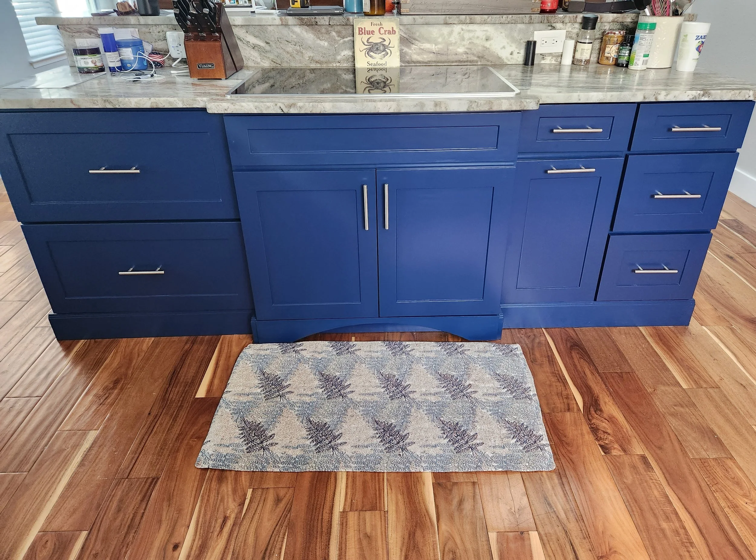 Kitchen Island painted navy blue to accent white cabinets.