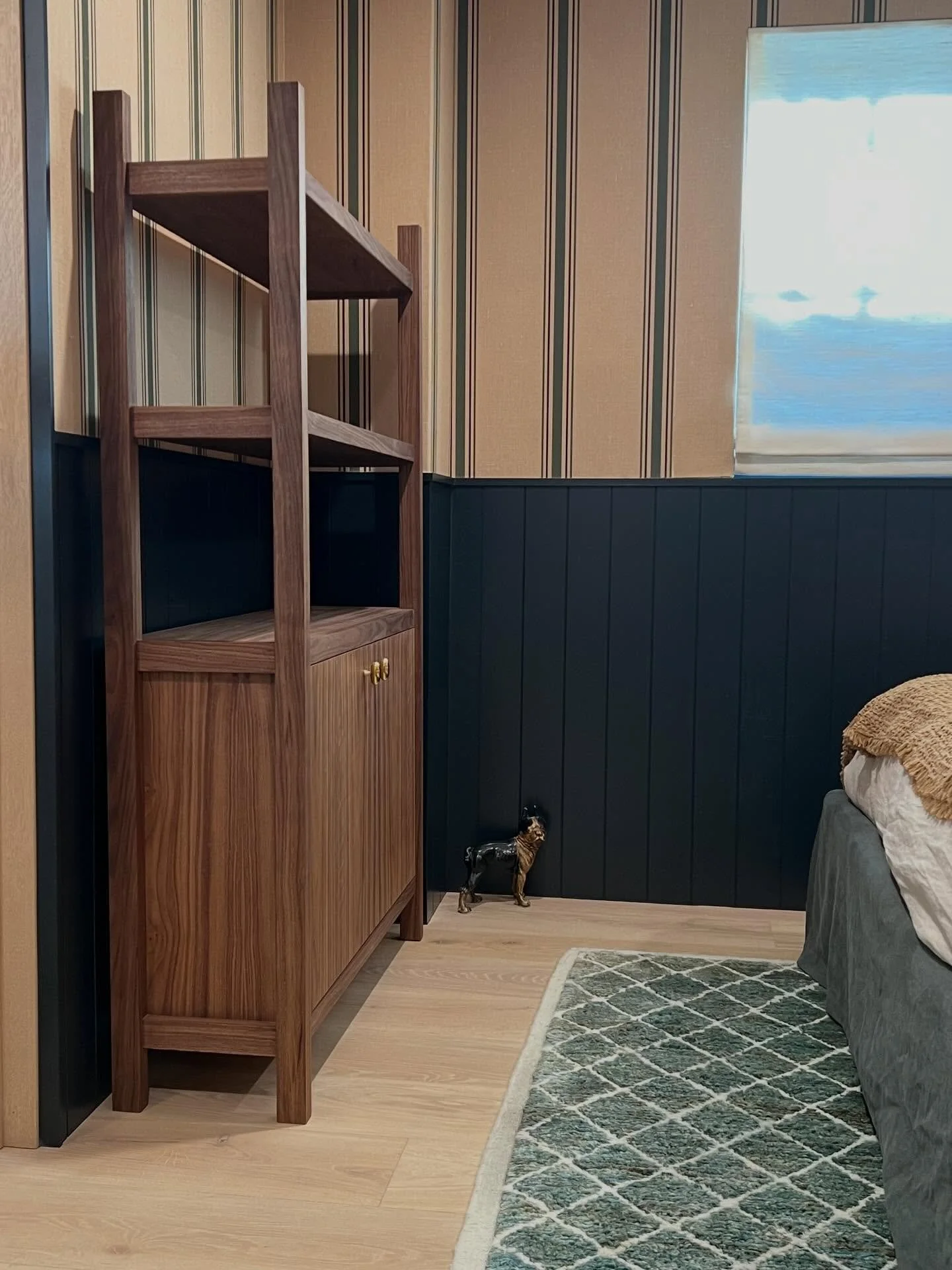 Custom walnut storage cabinet with open shelving, built to fit this space just right.

Lower cabinet for storage, open shelving above for everyday use, and a top shelf designed to hold something worth looking at.

We love these custom pieces that max