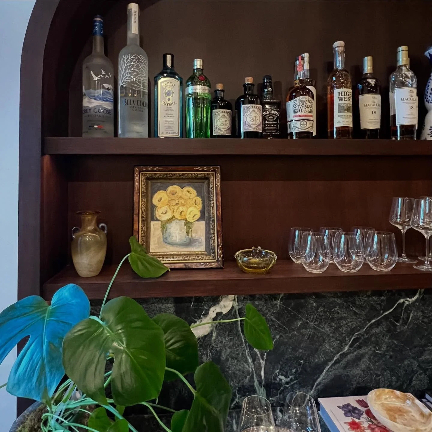 This built-in bar was all about the details &mdash; custom order rift cut walnut panels and veneer, walnut hardwood trim, custom walnut drawers. The arch measures close to 7&rsquo; above the counter with a two 9&rsquo; floating shelves to give it som