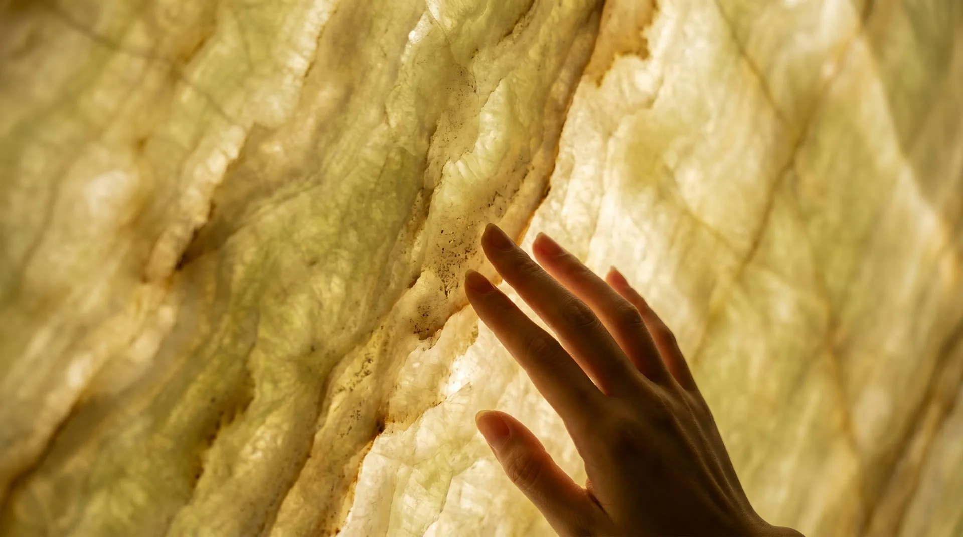 Translucent green onyx stone detail glowing with light