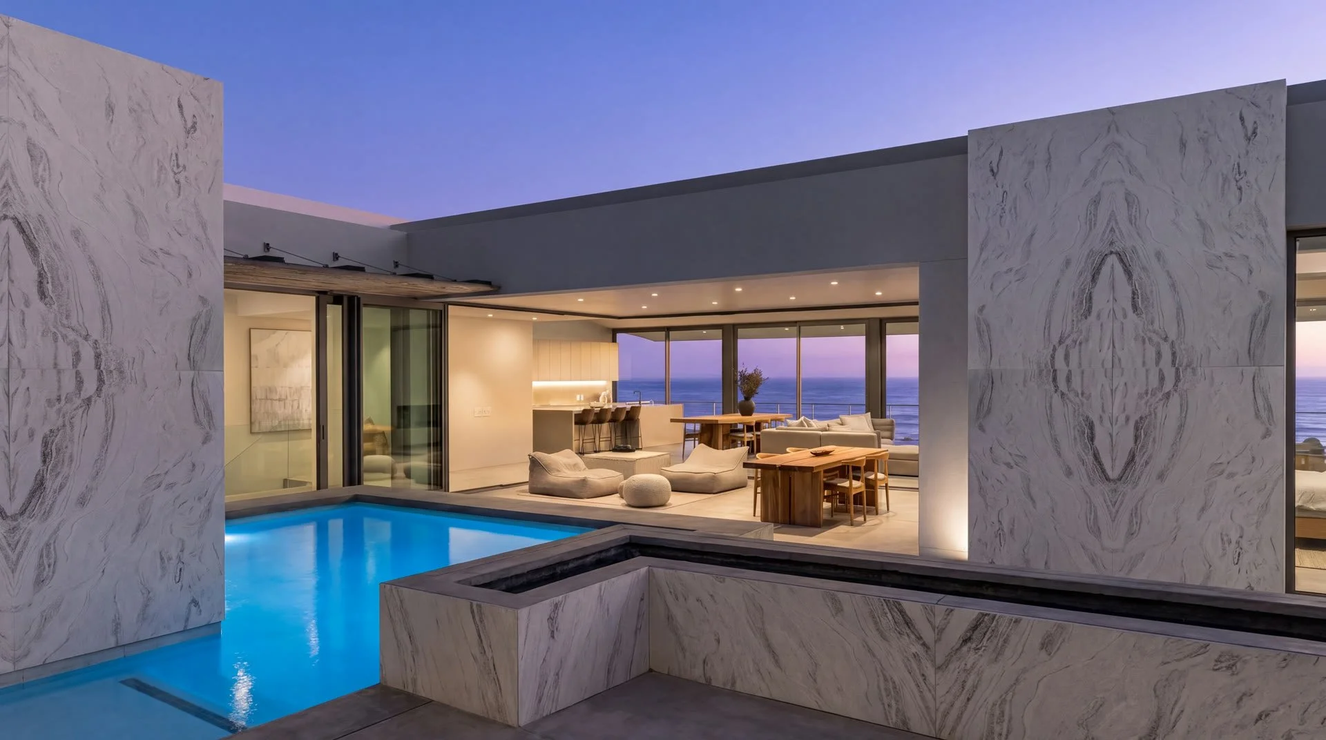 Home exterior at dusk with natural stone facade and garage