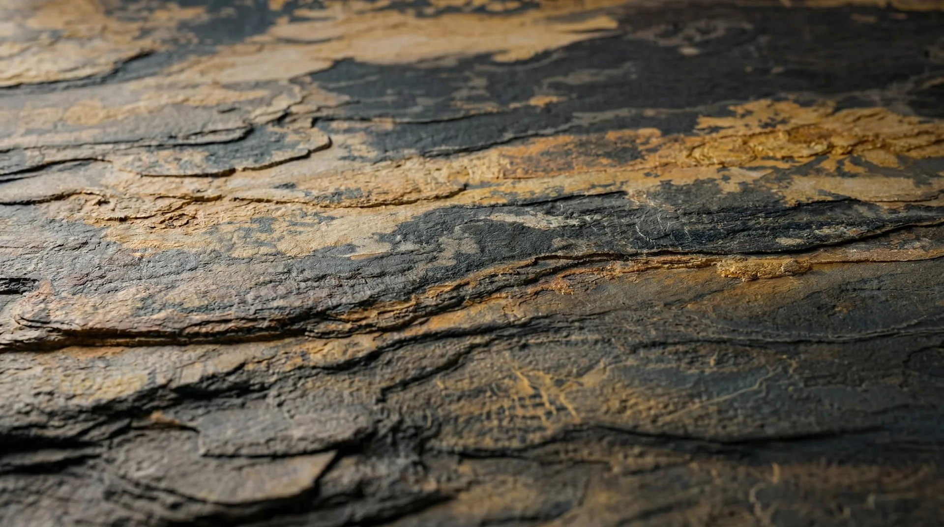 Rustic layered brown slate stone texture close-up