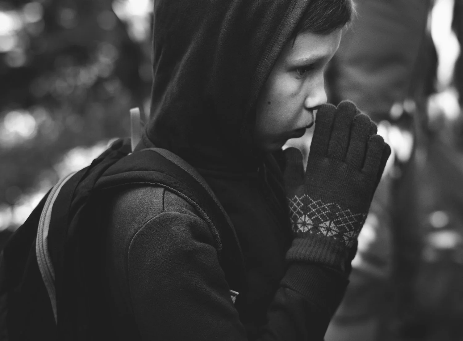 Child with hands clasped in prayer, representing religious abuse, spiritual pressure, or faith-related family concerns