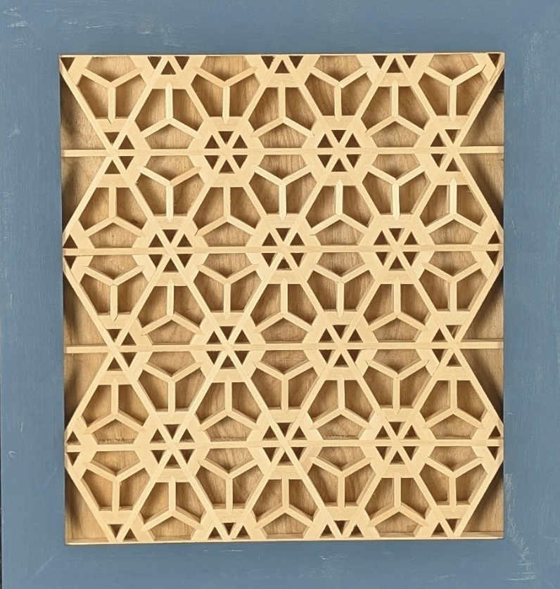 Chisel Champ - Decorative wooden lattice panel with a geometric pattern in a frame.