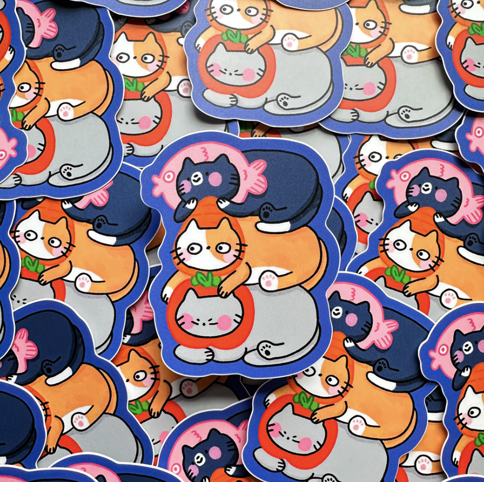 Ira Dino - A collection of colorful cartoon stickers featuring cats and fish in a playful style.
