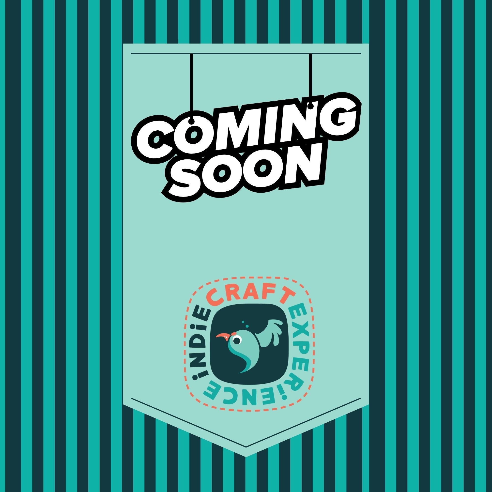A sign hanging with the words "Coming Soon" in bold black and white letters, against a background of blue and teal vertical stripes.