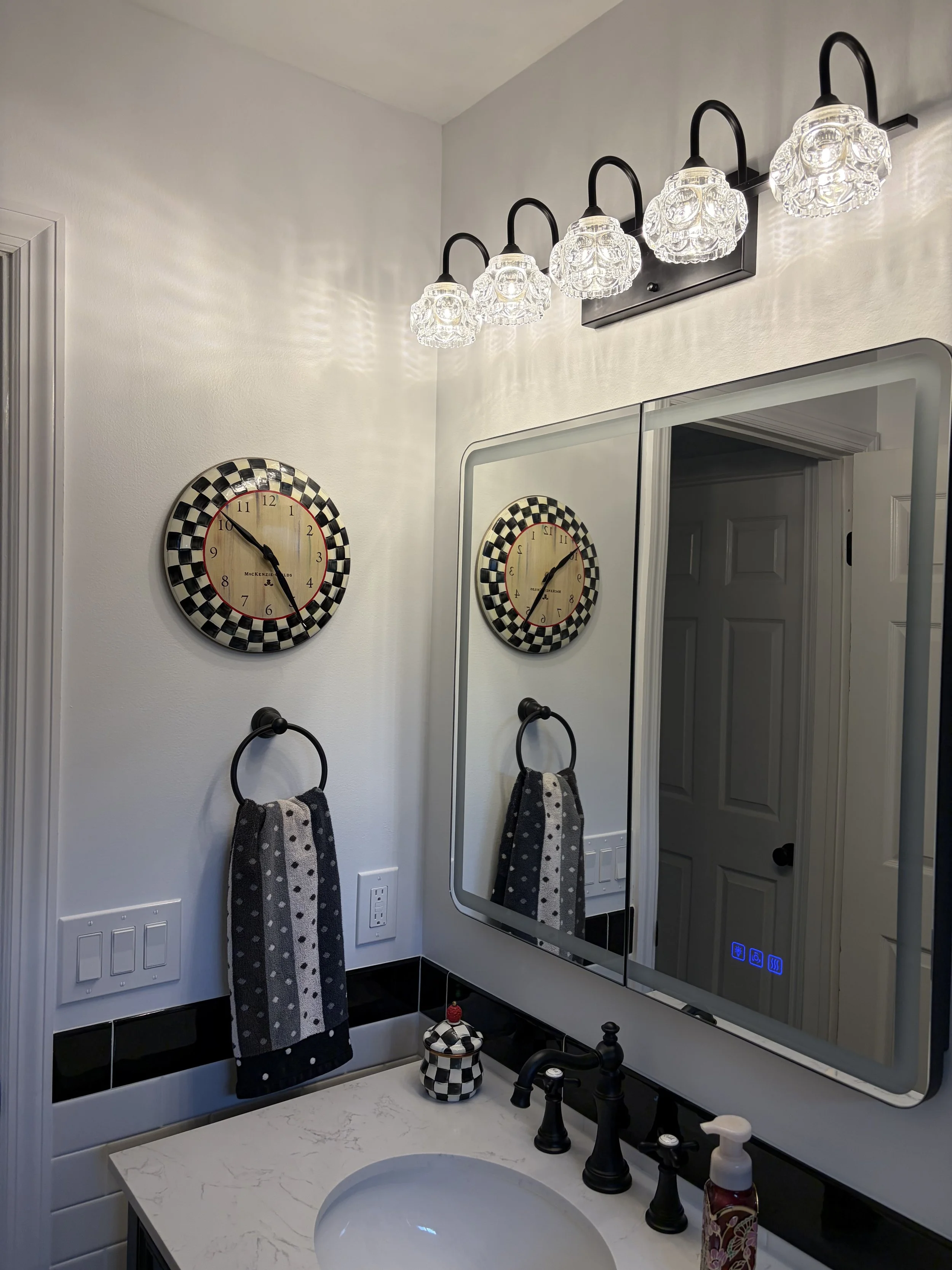 Custom sink and vanity with smart mirror.