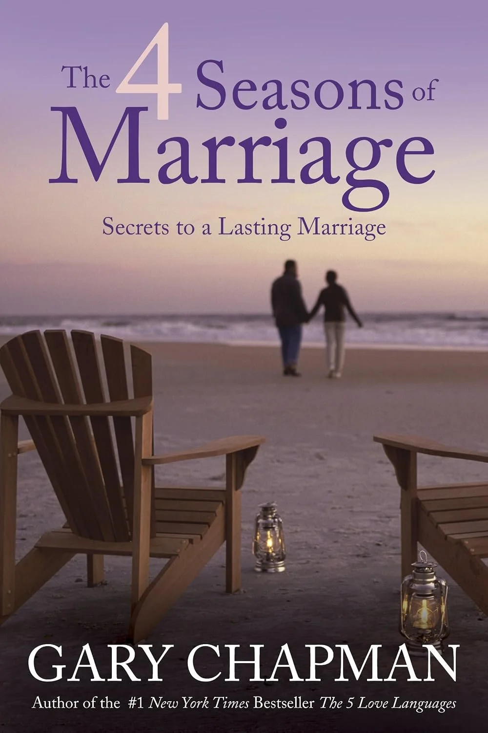 Book cover for 'The 4 Seasons of Marriage: Secrets to a Lasting Marriage' by Gary Chapman. The cover features a beach scene at sunset with two people holding hands walking along the shoreline, two wooden chairs with lanterns nearby.