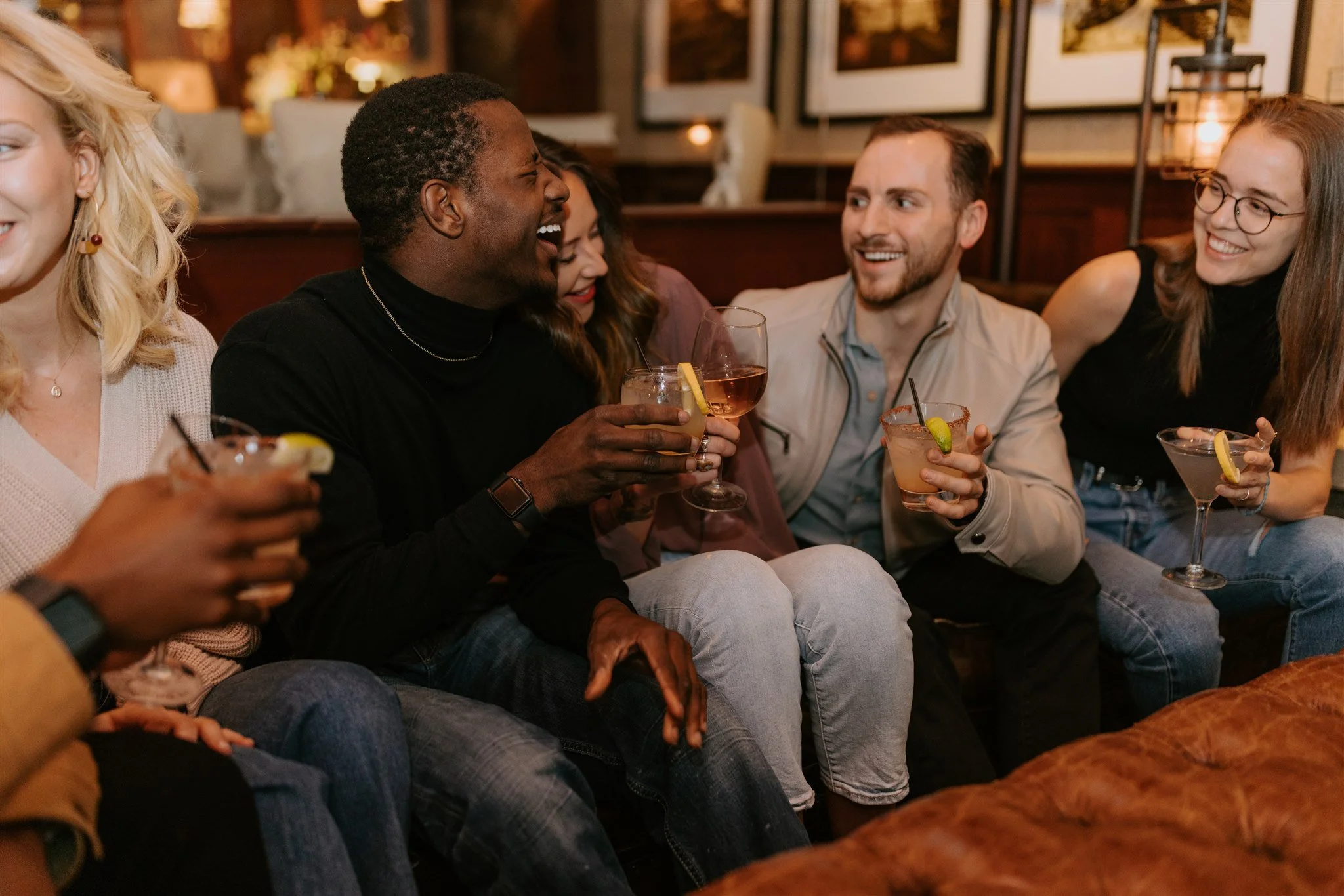 Group of friend having a drink and fun at the classic american grill restaurant