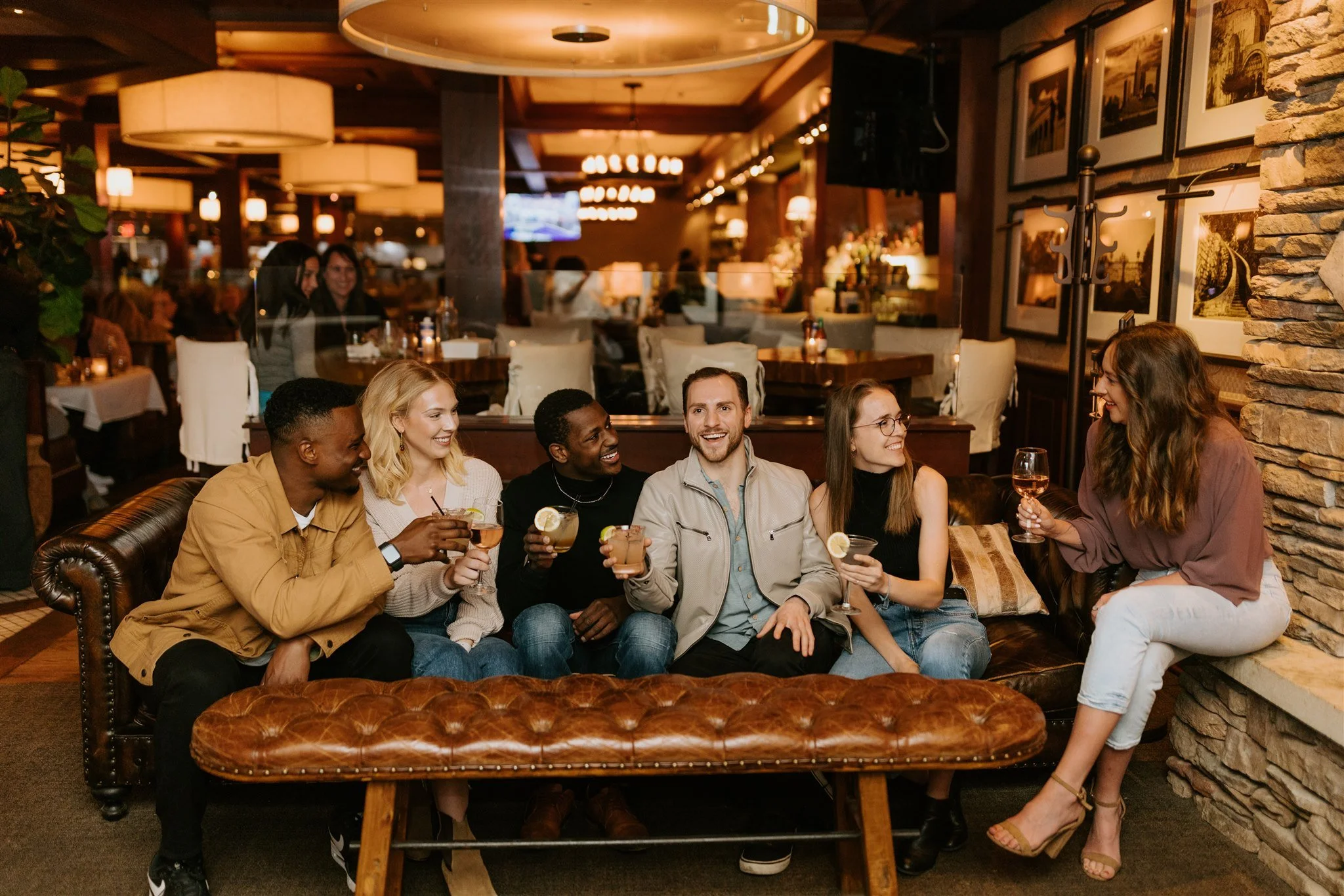 Group of friend having a drink at the classic american grille restaurant
