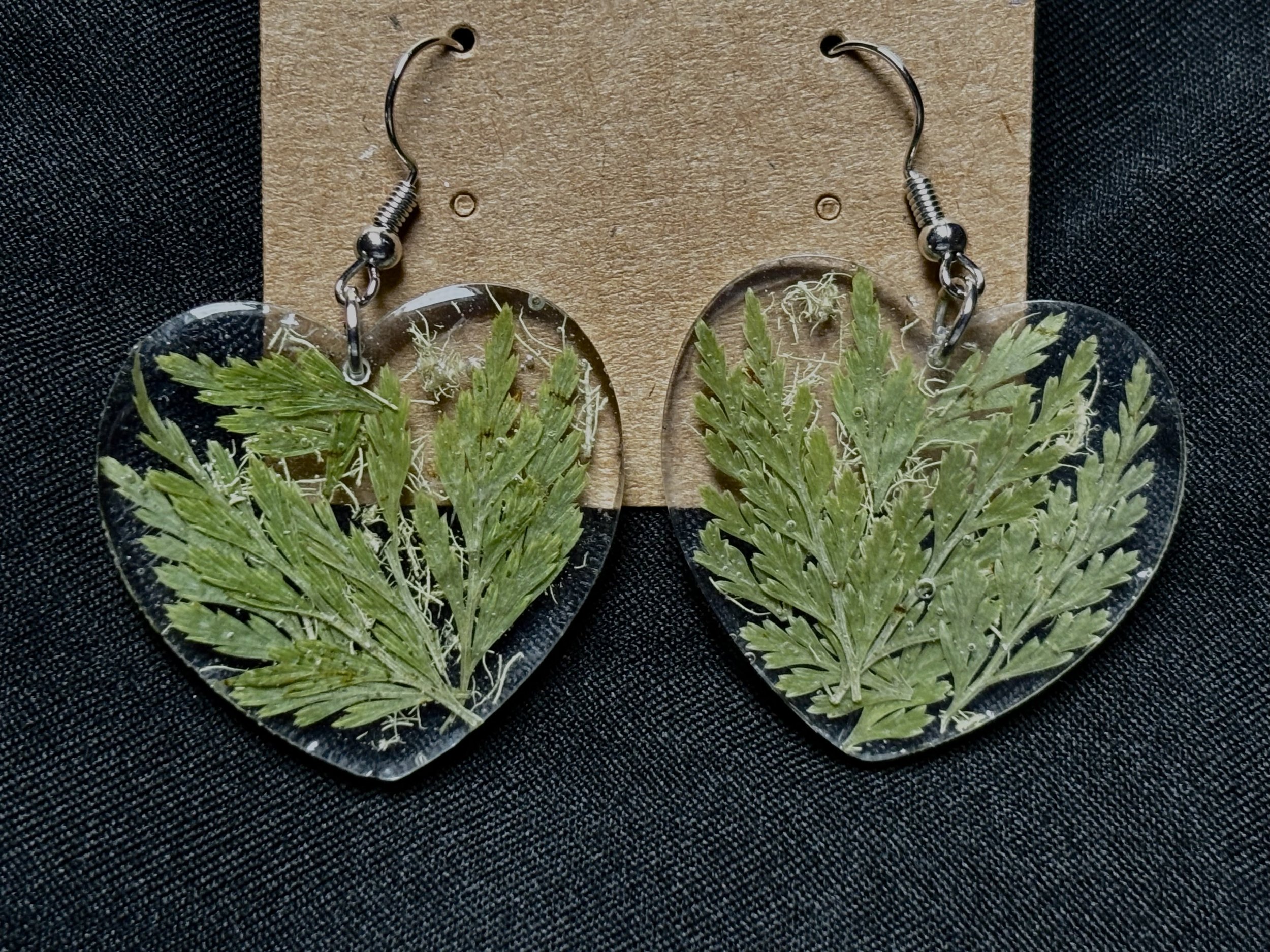 Heart shaped earrings with ferns and lichen