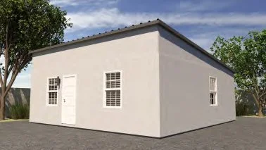 A plain white building with a door and a few windows, set against a partly cloudy sky.