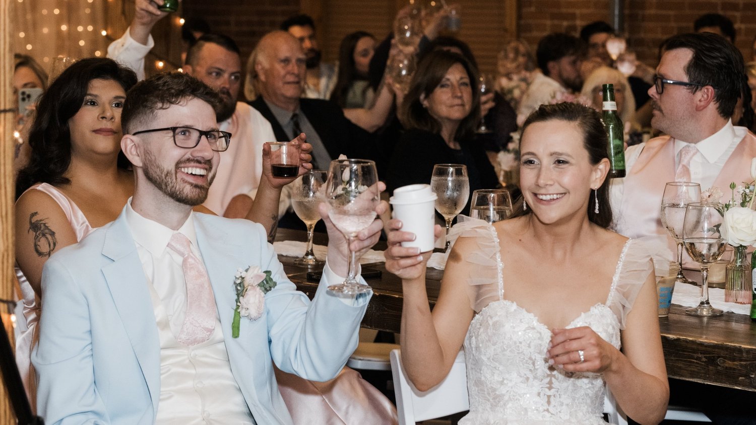 Bride and groom celebrating during their wedding reception