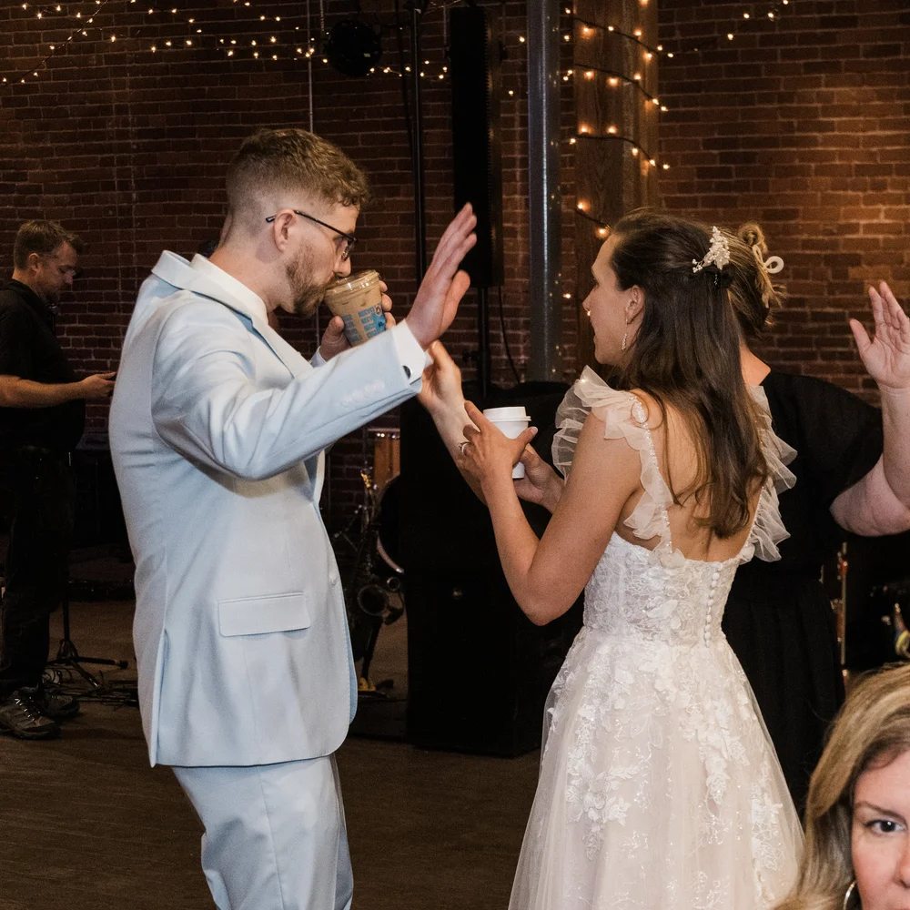 Newlyweds dancing during an evening wedding reception