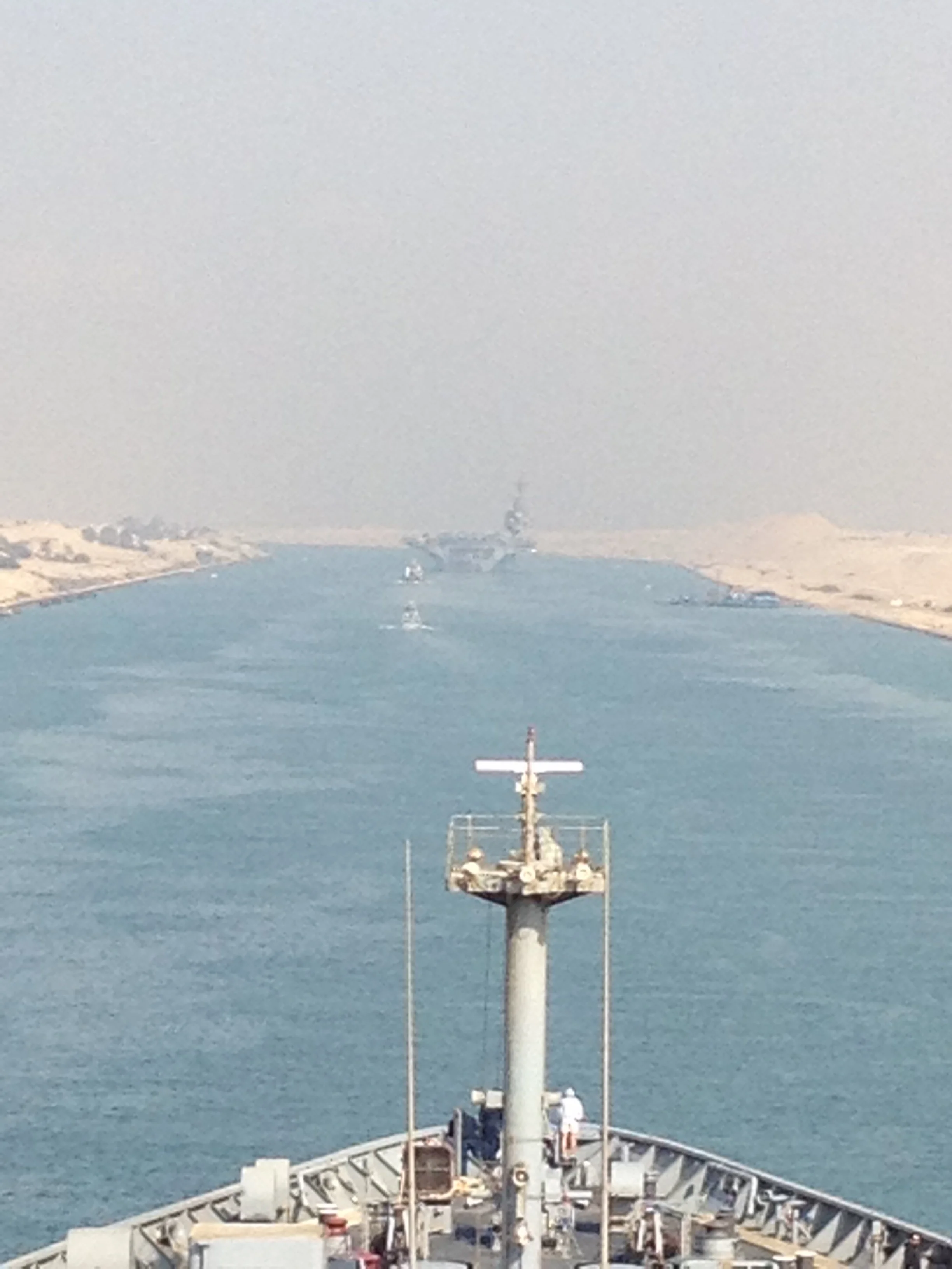 Following an US aircraft carrier through the Suez Canal. 
