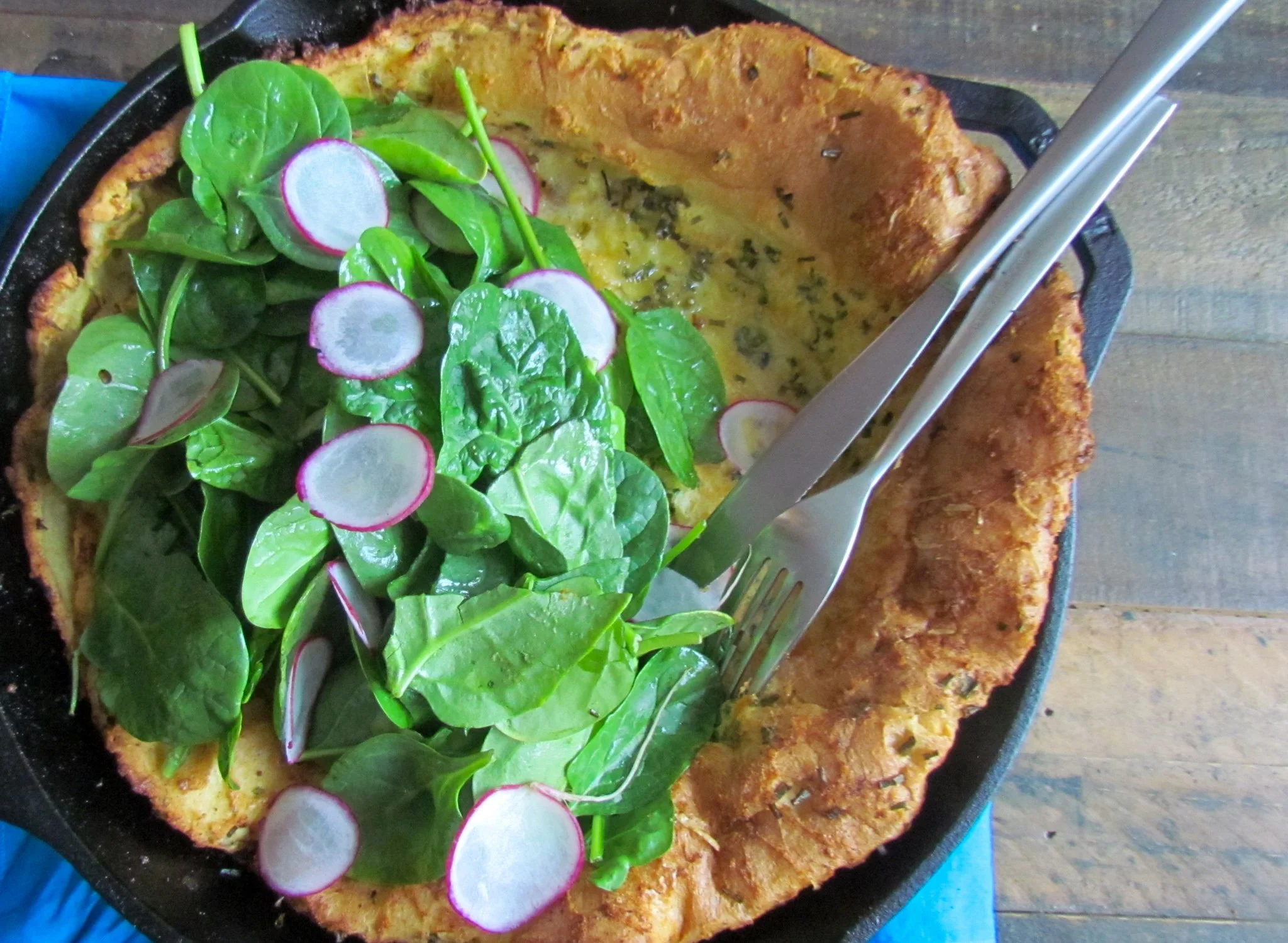 Dutch baby with a salad wide shot.jpg