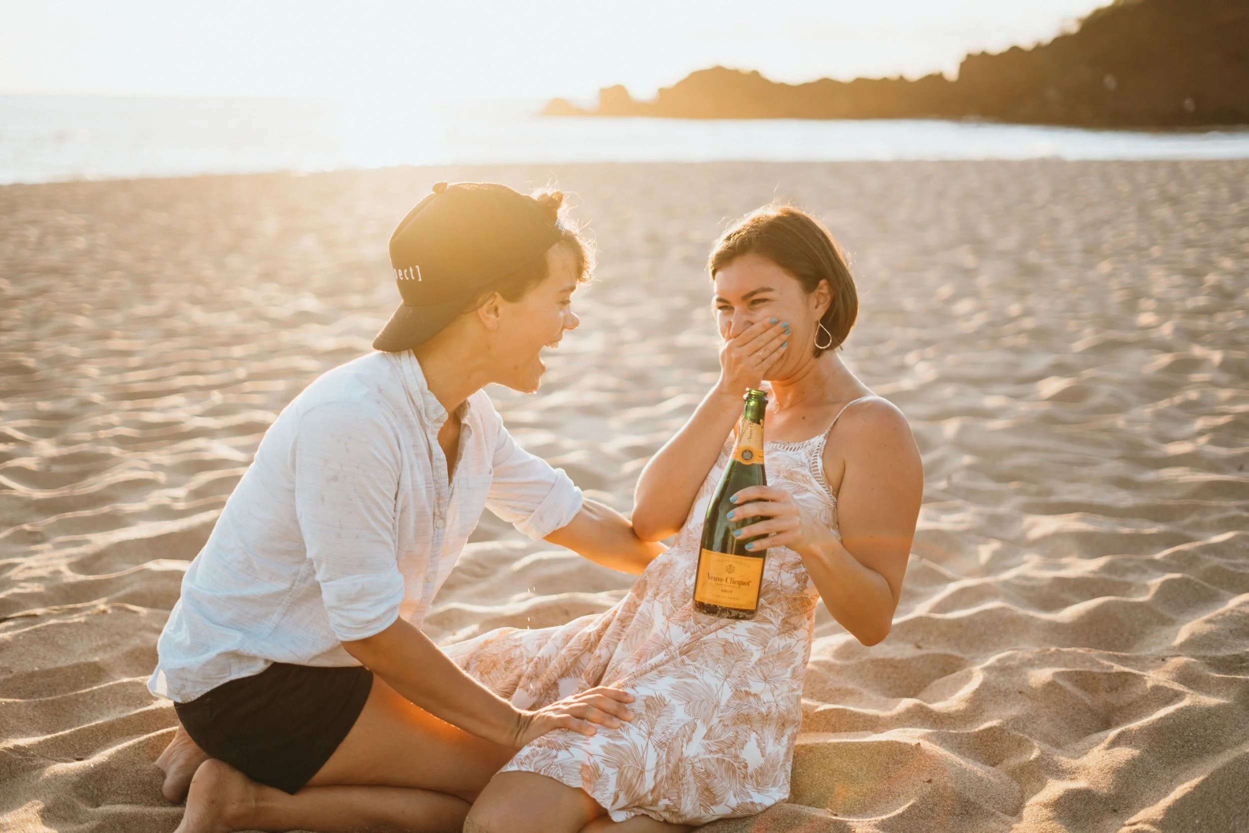 A gay queer couple participates in a water-based engagement session with natural surf motion. The environment enhances candid storytelling and emotional presence. This Colorado elopement photographer works with LGBTQ+ couples across Vail and Rocky Mo
