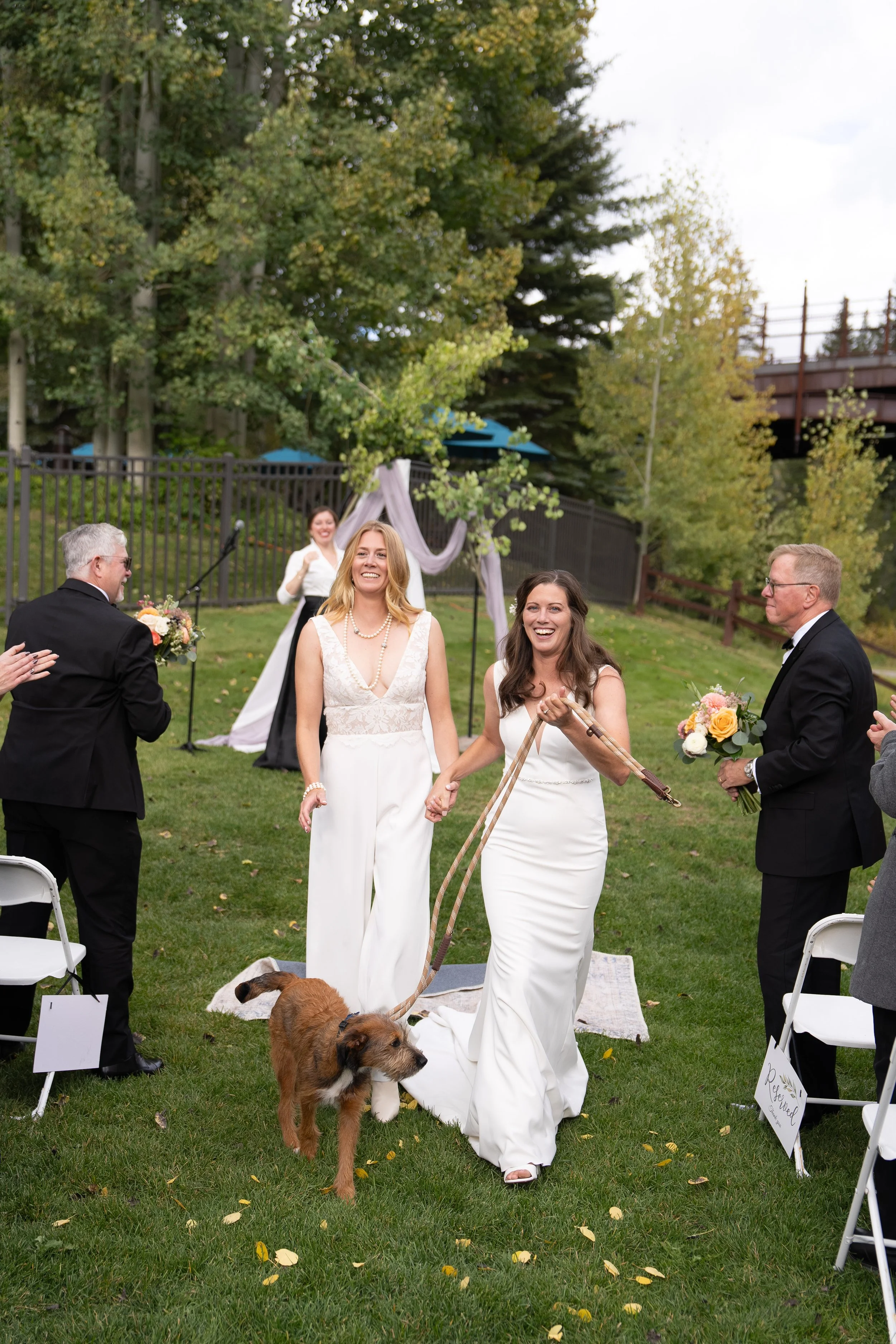 A queer wedding celebration takes place in Colorado with a same-sex couple surrounded by natural mountain scenery. The day is documented with a balance of candid moments and thoughtful composition. I specialize in LGBTQ+ weddings and elopements acros