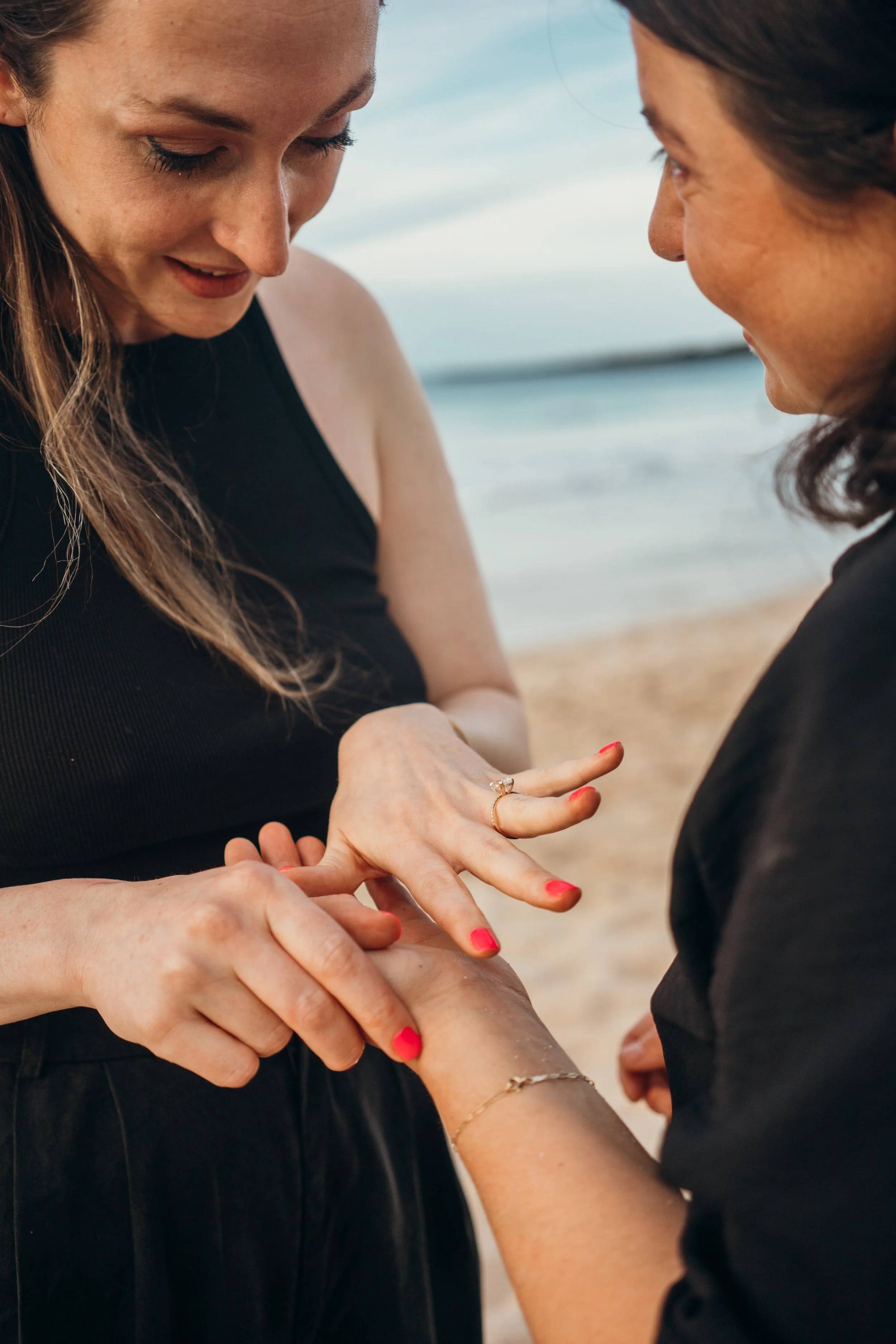 This LGBTQ+ couple session shows a gay couple interacting in downtown Denver streets. The scene is candid and documentary in style. The photographer is based in Colorado and specializes in queer elopements across both urban and outdoor locations. The