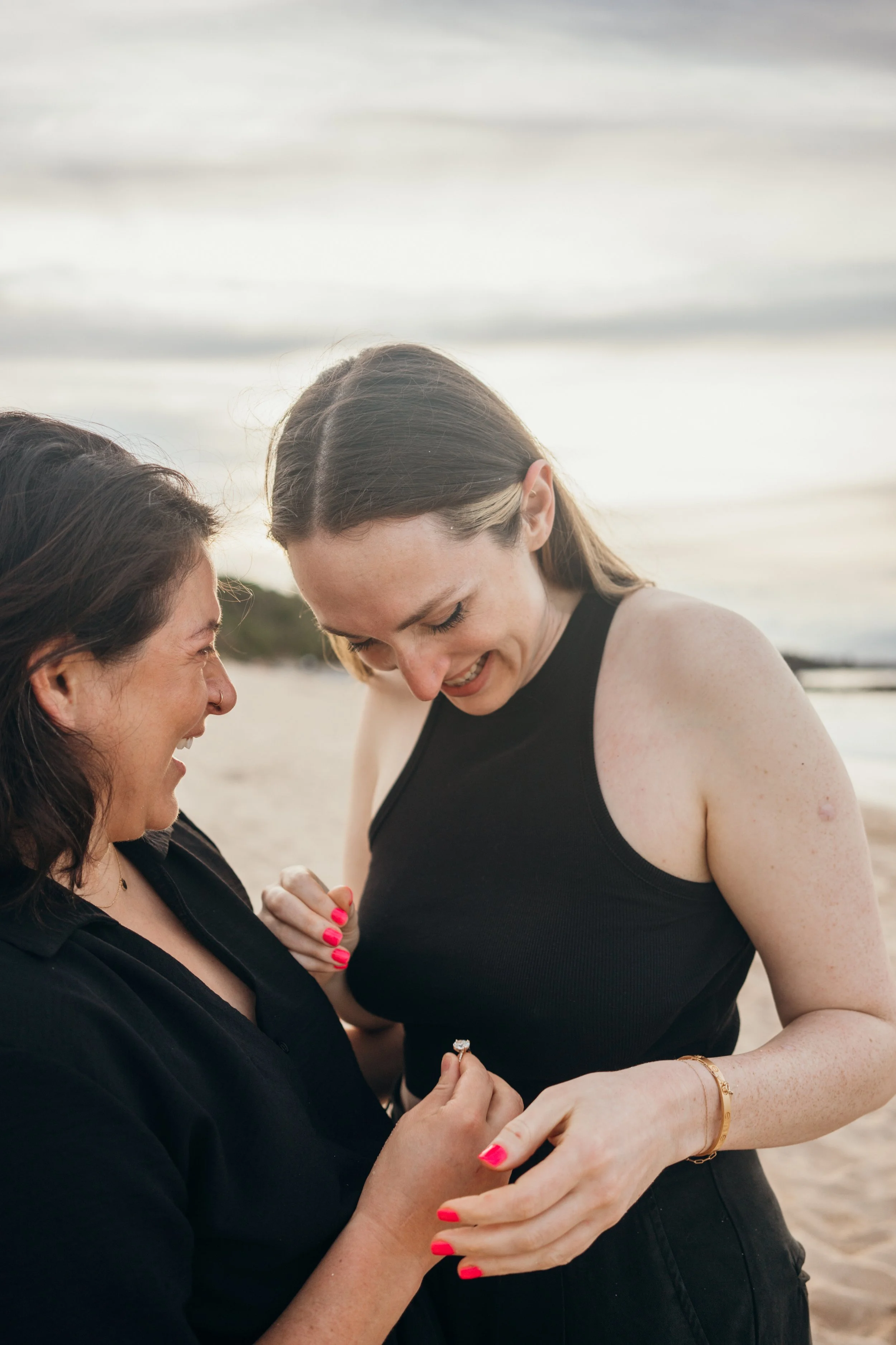 This lesbian queer couple session documents a romantic urban walk through downtown Denver. The couple’s interaction is unposed and emotionally grounded. The photographer specializes in LGBTQ+ elopement storytelling across Colorado, including Colorado
