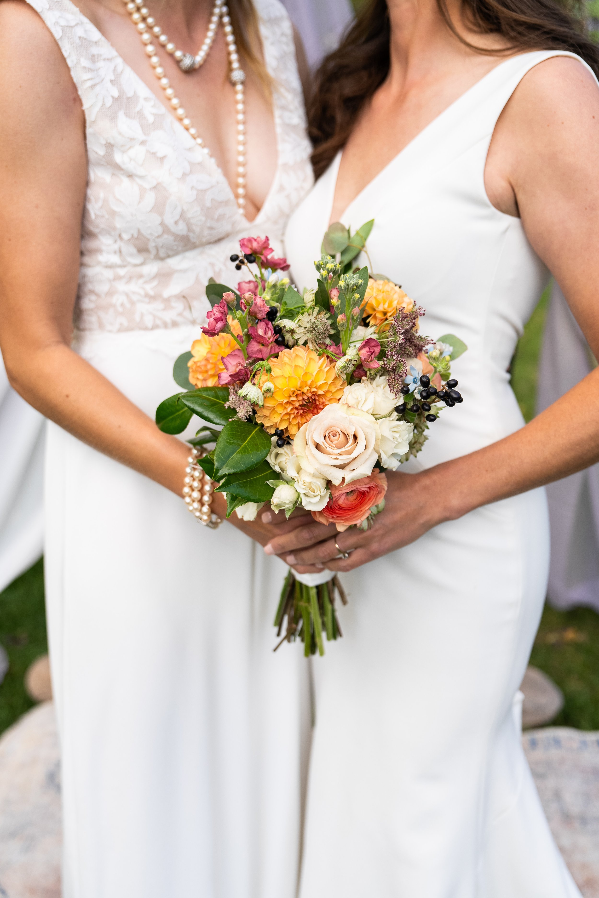 This gay wedding in Colorado captures a queer couple celebrating their marriage in a natural outdoor setting. The focus is on candid emotional connection and the energy of the moment. As a Colorado-based photographer, I work with LGBTQ+ couples acros