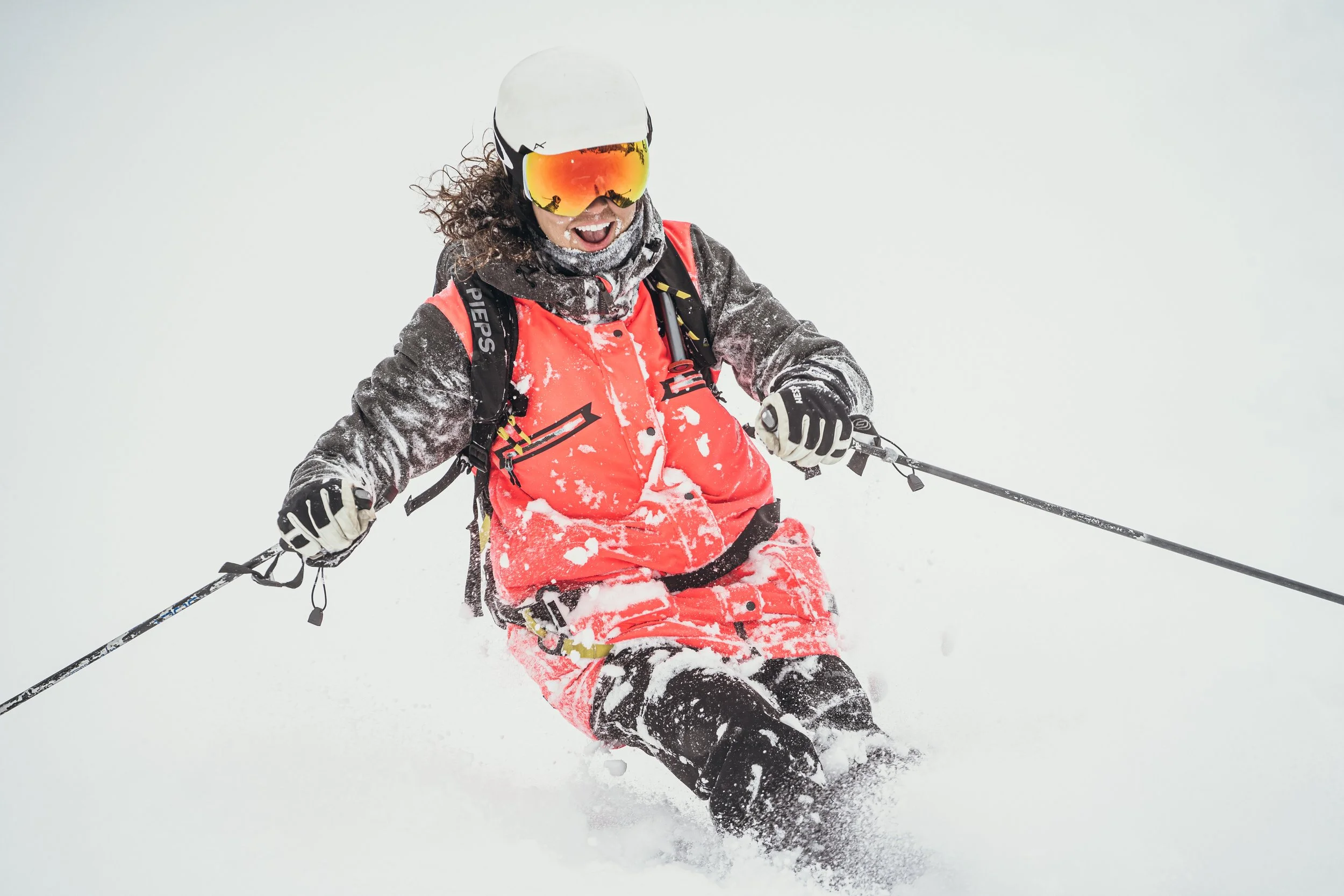 Colorado LGBTQ+ photographer Rachael enjoying a day skiing in the Rocky Mountains. Adventure and exploration play a large role in both her personal life and photography style, inspiring authentic sessions for couples, families, and elopements.