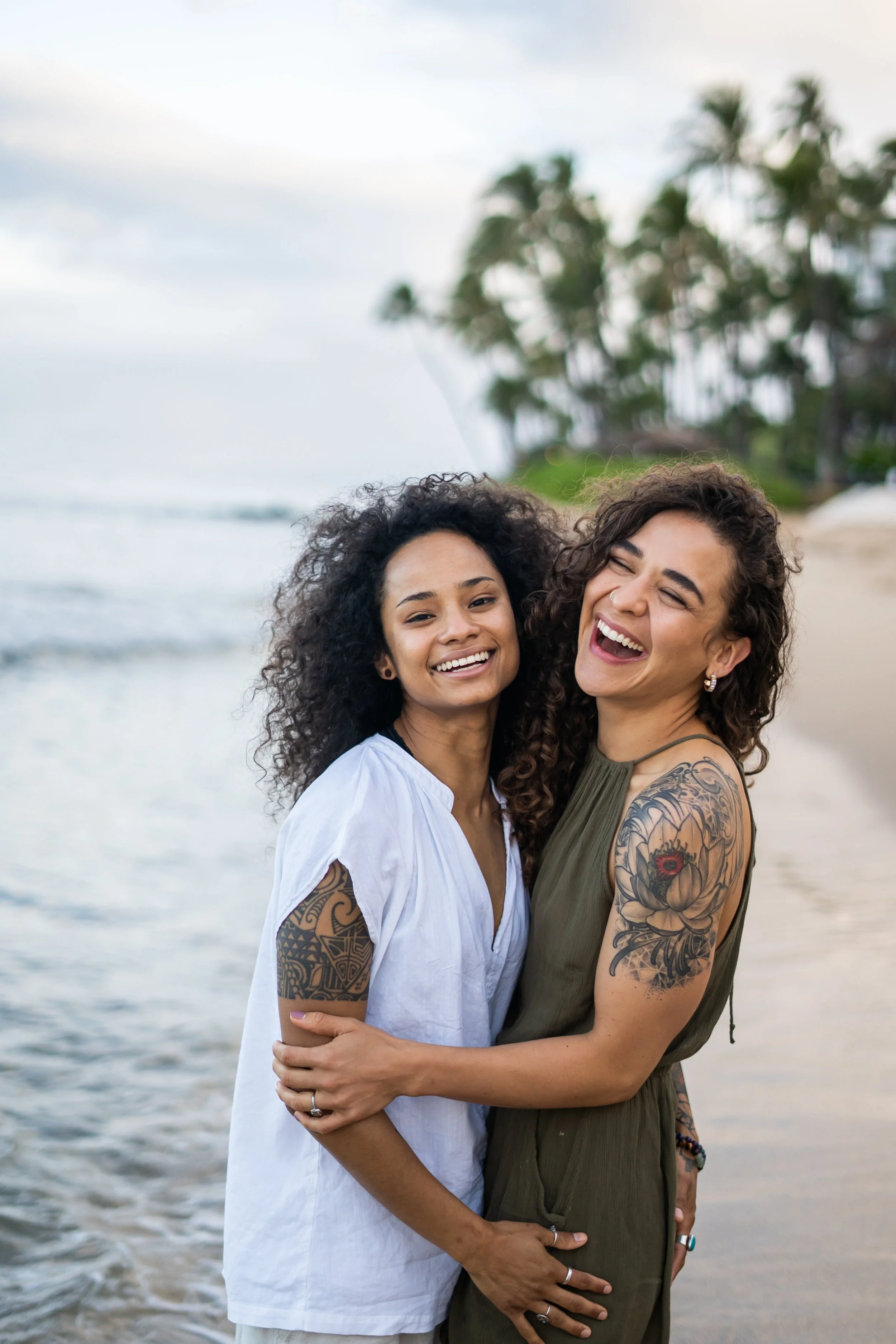 A same-sex engagement-style session takes place in a Colorado alpine foothills setting. The couple shares a natural moment of connection surrounded by expansive scenery. This Colorado-based photographer works with queer couples across Vail and Rocky 