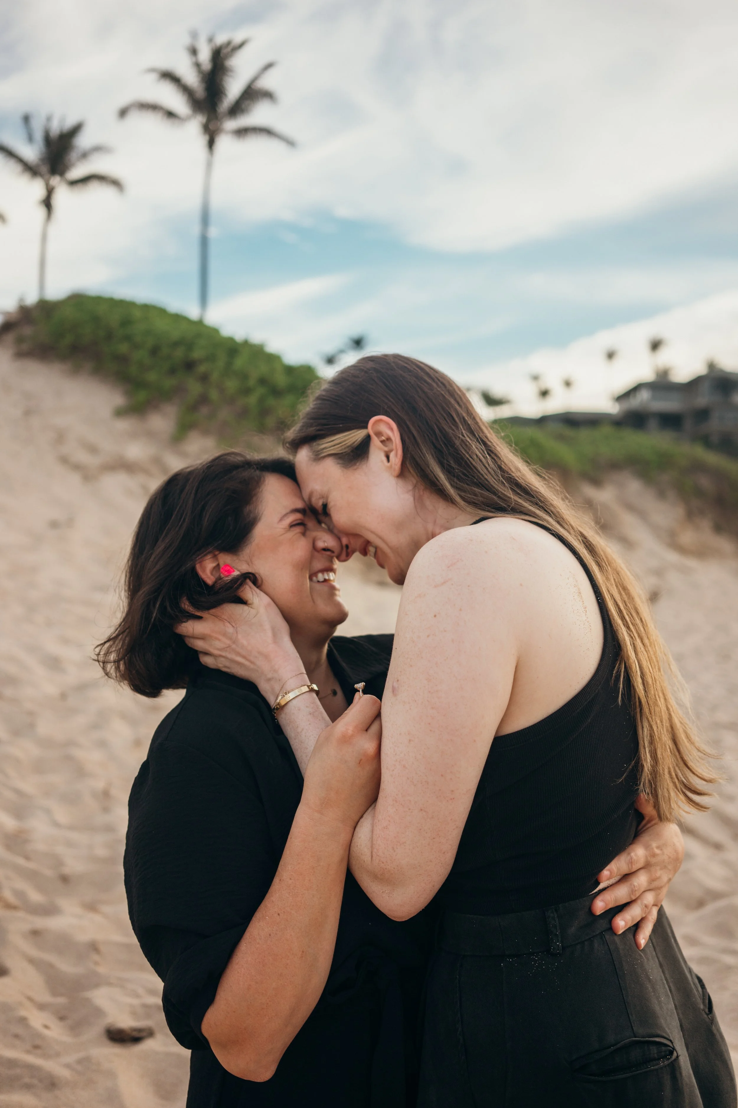 A gay couple is captured in a downtown Denver setting with natural movement and candid interaction. The architecture and city light create a cinematic urban feel. This Colorado-based elopement photographer works with LGBTQ+ couples across both city a
