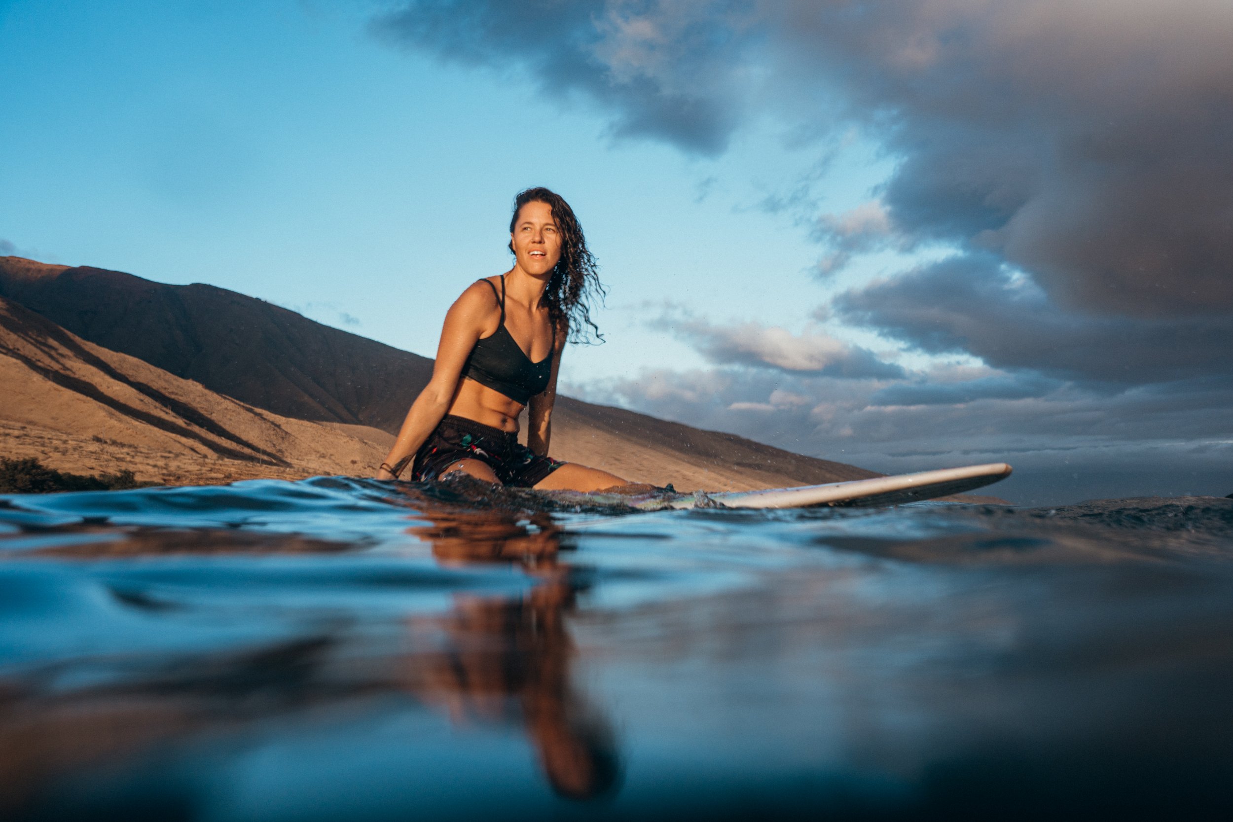 Surfing taught Rachael the importance of patience, resilience, and embracing uncertainty. Those same values influence how she photographs LGBTQ+ couples, families, and small businesses throughout Colorado and beyond.