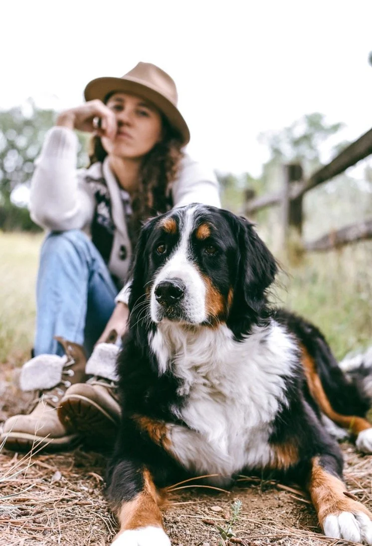 Colorado photographer Rachael spending time with her dog outdoors. Many of her couples and family photography sessions include beloved pets as part of the story.