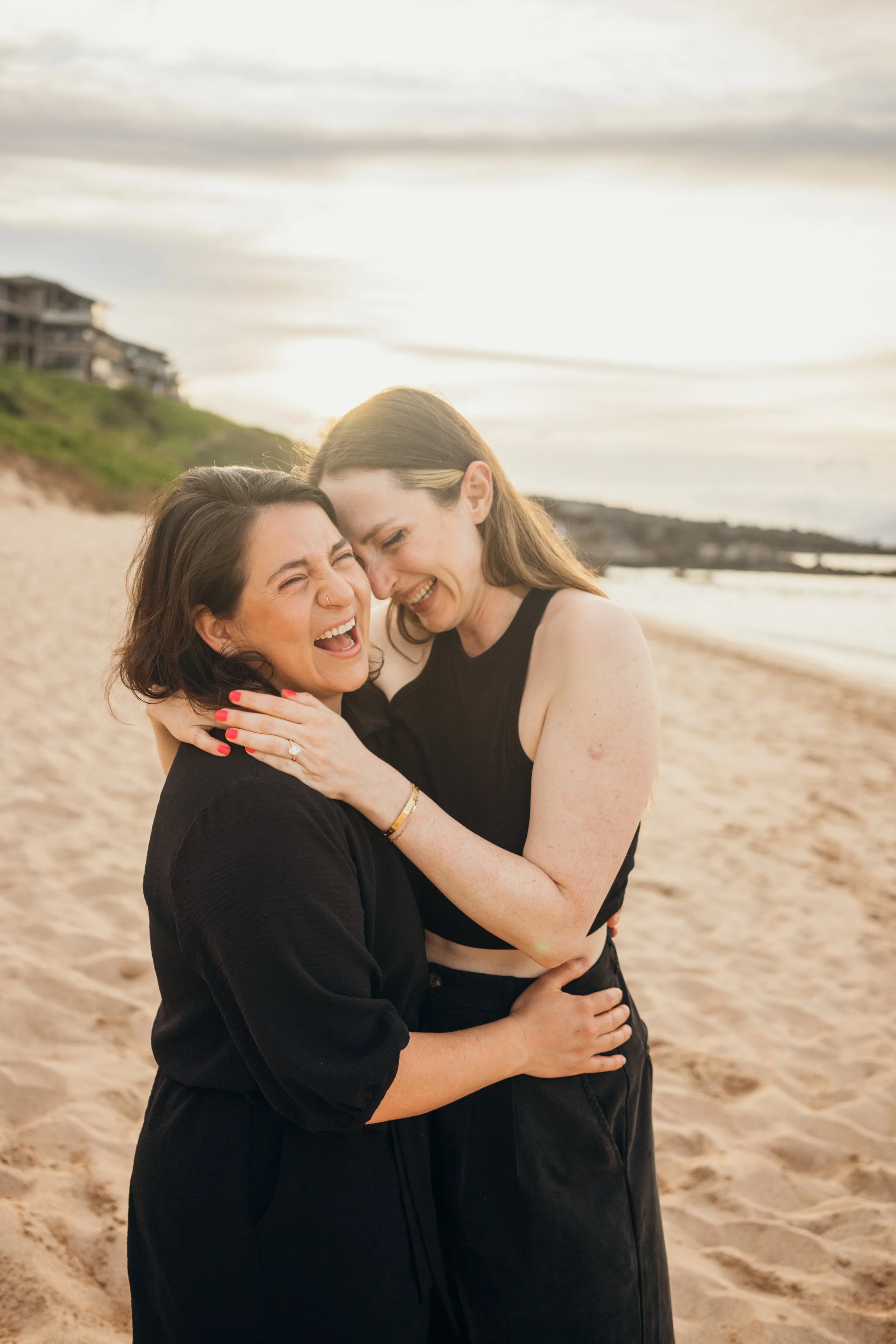 This queer engagement-style session captures a same-sex couple walking through downtown Denver together. The city setting enhances the cinematic and modern feel of the image. The photographer specializes in LGBTQ+ couples across Colorado, including m