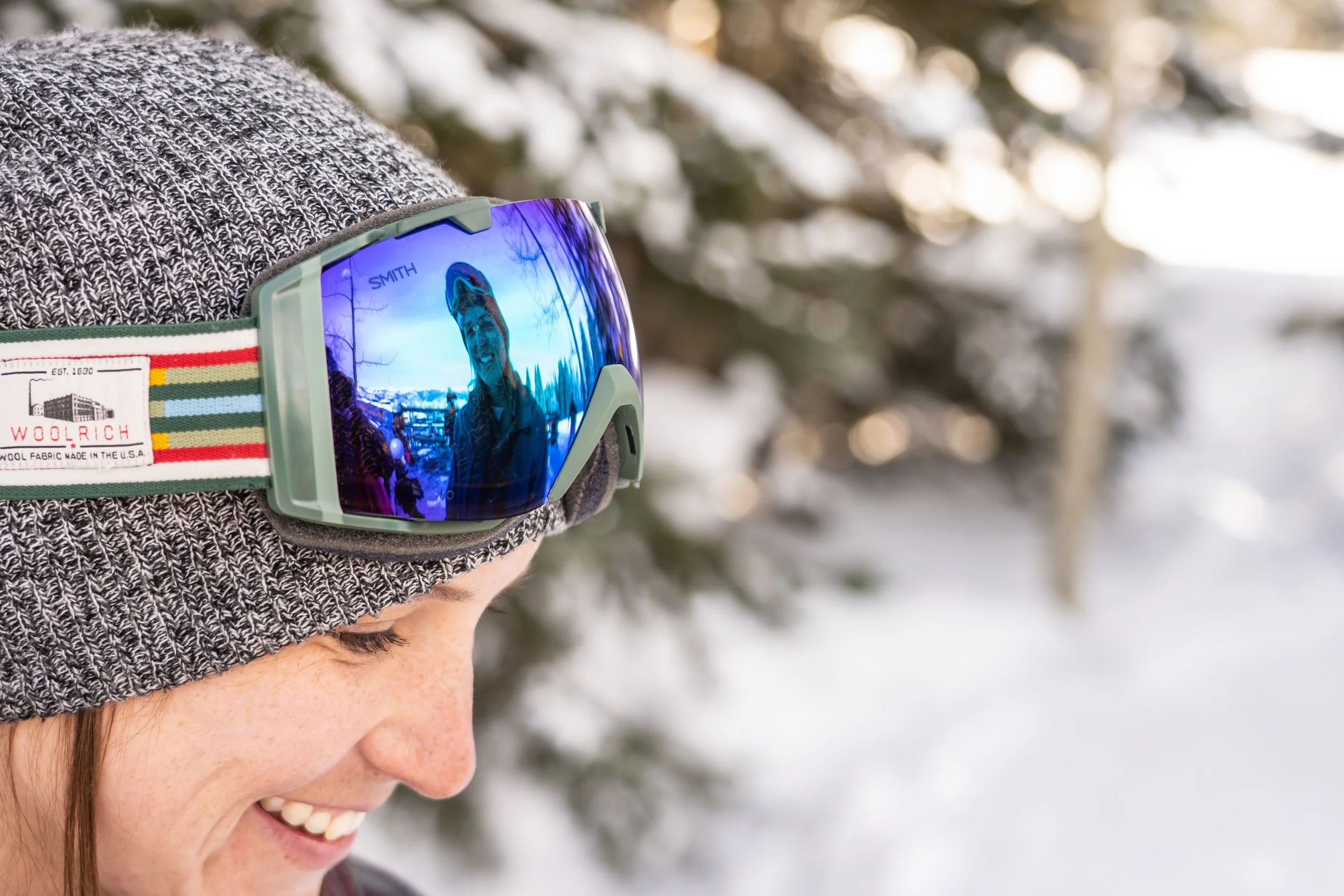 This same-sex engagement moment documents a snowboard proposal in a dramatic Colorado winter environment. Snow-covered peaks create a wide, cinematic backdrop. The photographer’s work is rooted in Colorado storytelling across Denver, Boulder foothill