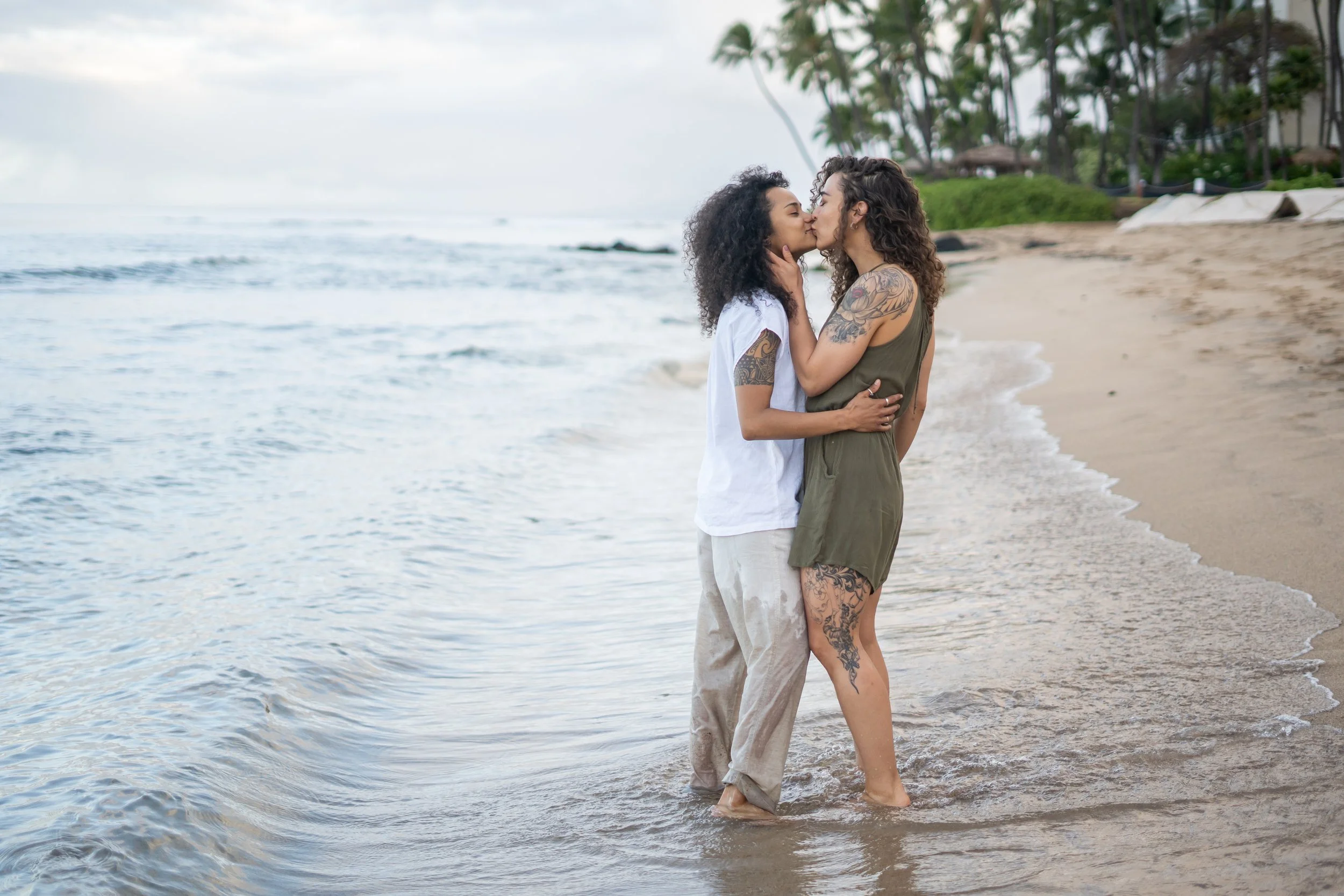 A gay couple is photographed in a Colorado foothills setting with a focus on candid interaction. The natural environment enhances emotional storytelling and connection. This LGBTQ+ elopement photographer works across Boulder, Denver, and mountain reg