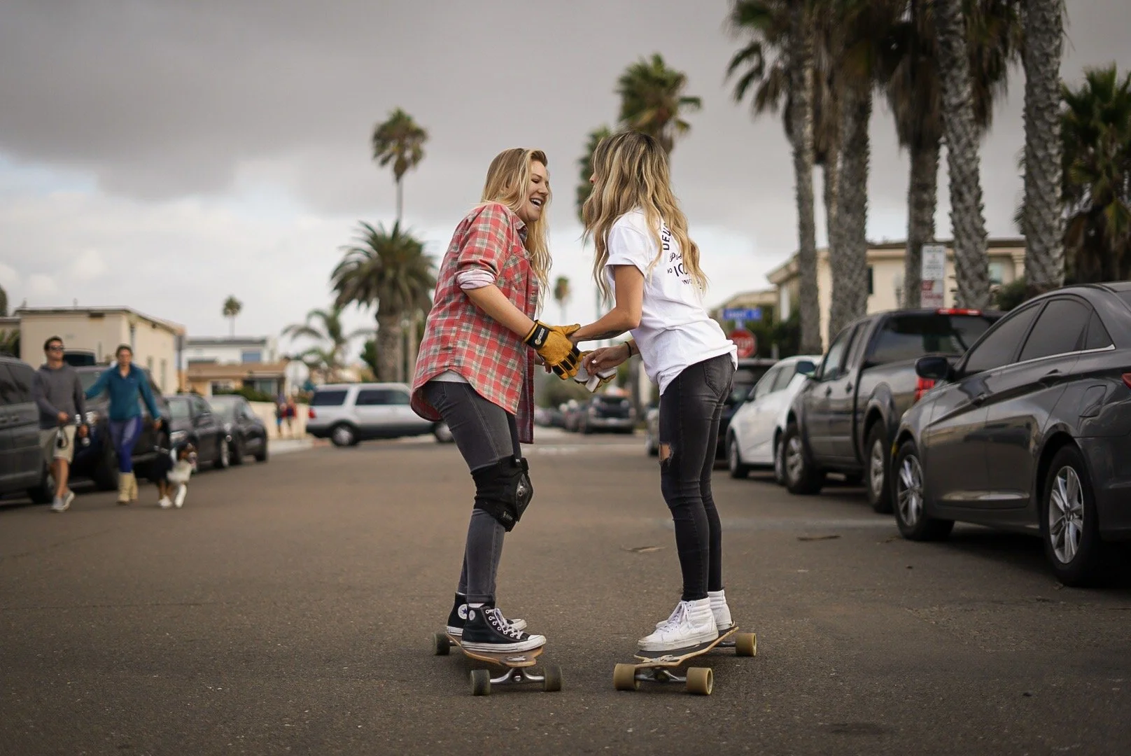 A gay couple is documented in a downtown Denver setting with a focus on candid interaction. The urban landscape provides a clean, modern backdrop for LGBTQ+ storytelling. This Colorado-based photographer works with queer, lesbian, and gay couples acr
