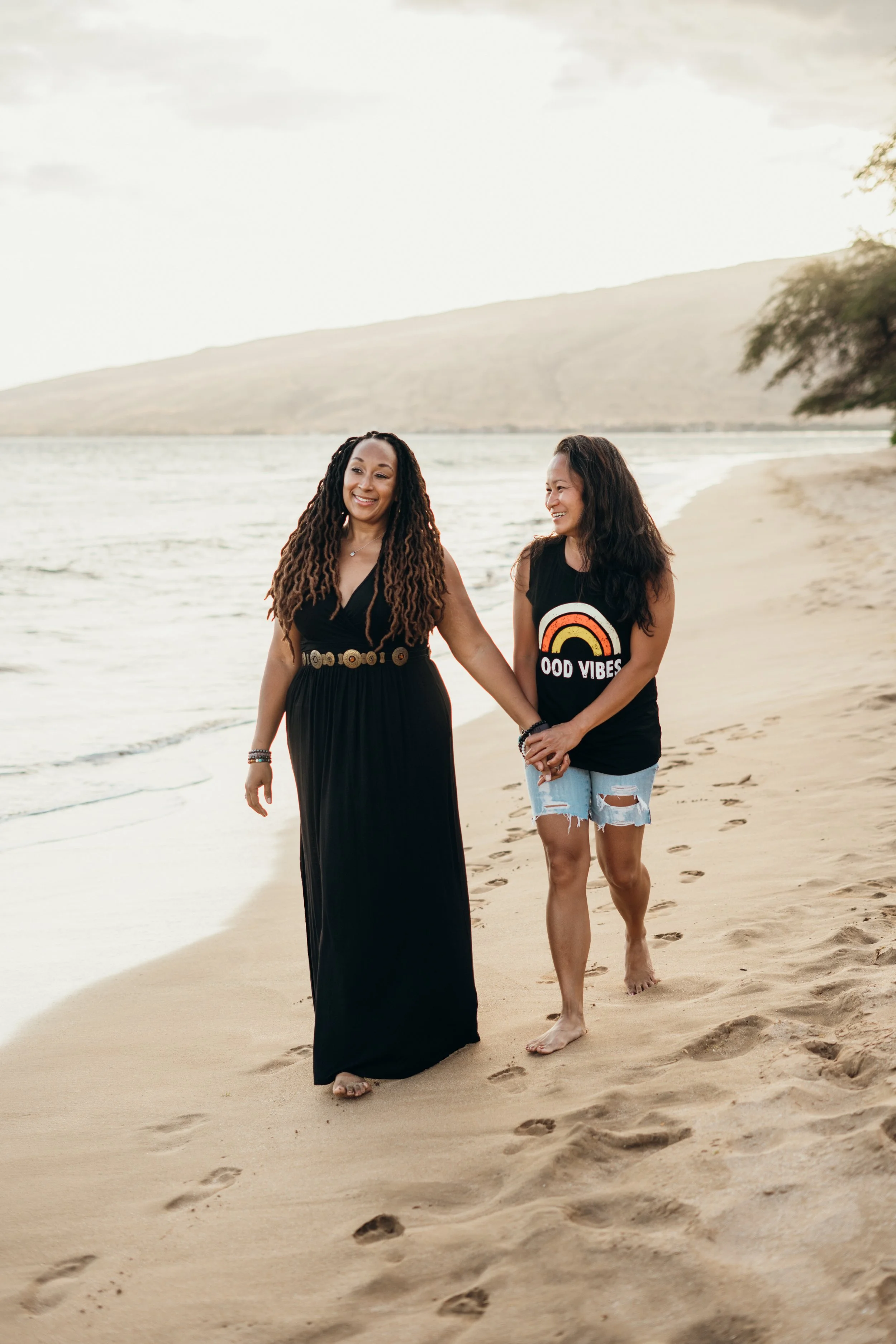 A lesbian couple is photographed skateboarding together in a Denver city setting. The session is candid, playful, and emotionally grounded. This LGBTQ+ photographer specializes in queer, gay, and lesbian couples across Colorado. The style reflects bo