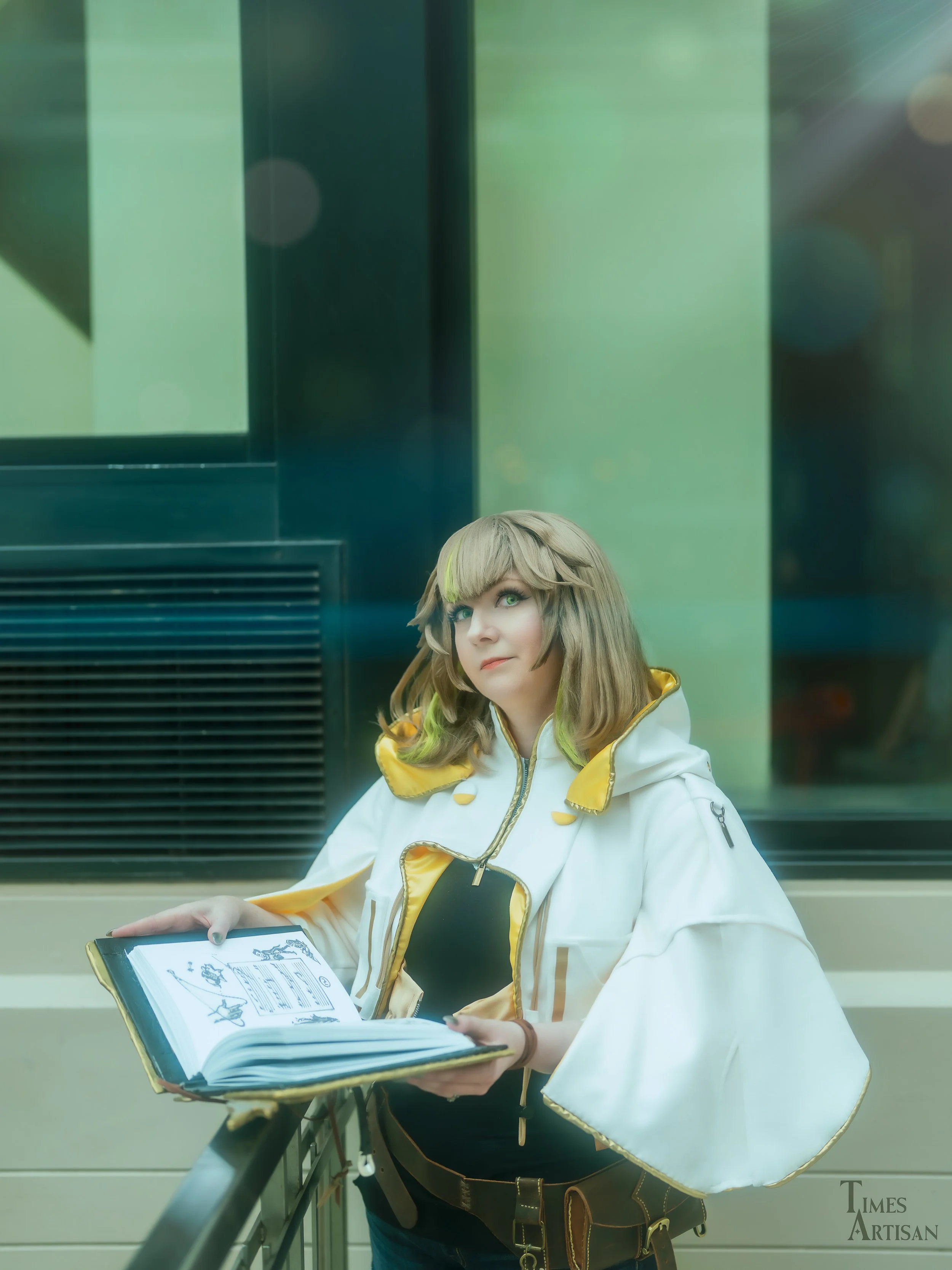 Sphene Alexandros
Final Fantasy XIV 

Jacket and leather belt made by me. 
Melodies of Life grimoire made by me. 
Wig is @ardawigs Nina in desert brown, cut and styled by me. 
📷: @times.artisan 

#animeboston2026 #sphenealexandrosxiv #finalfantasyxi
